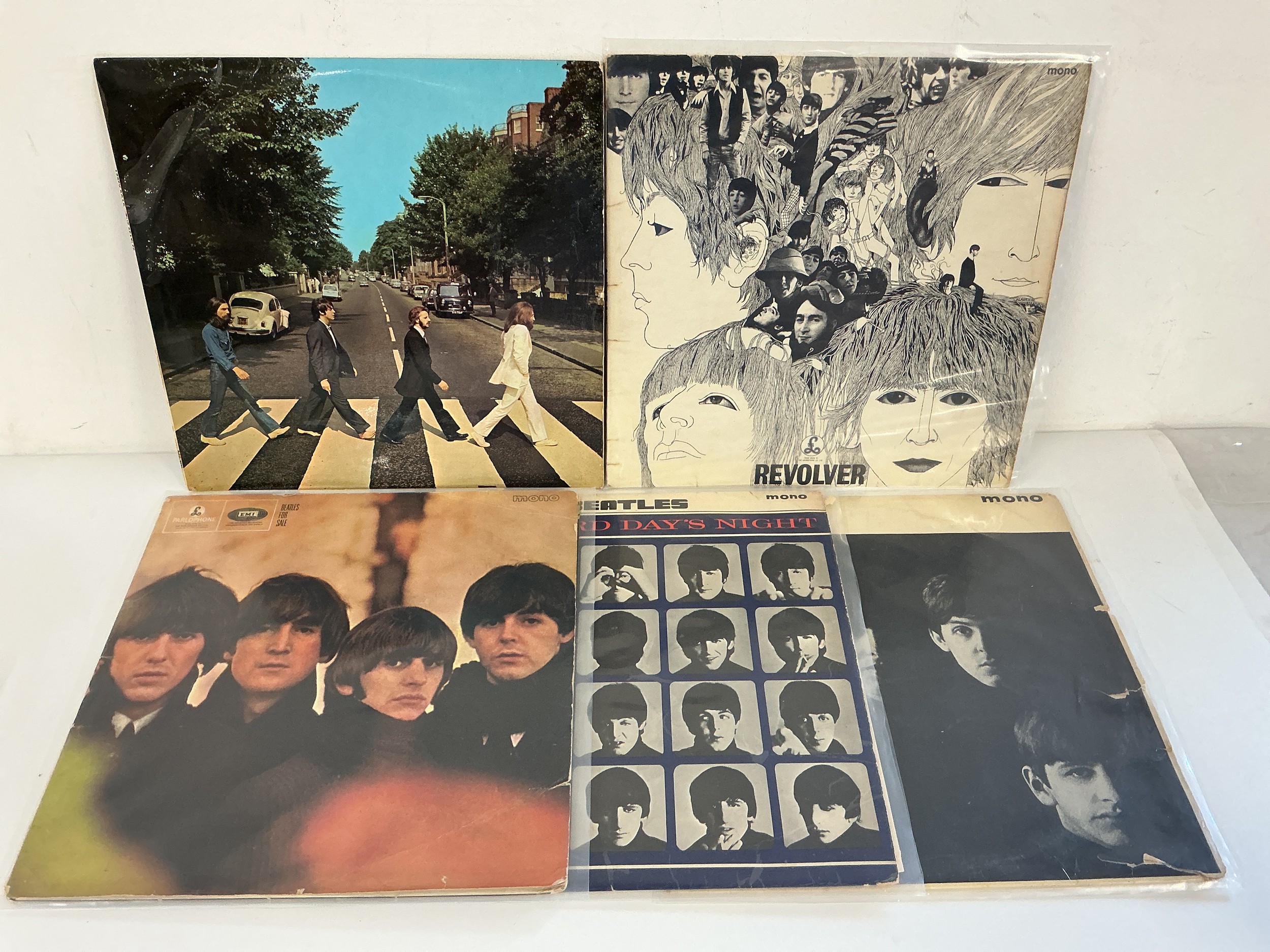 A collection of Beatles LPs, EPs and 7" singles comprising early UK pressings of Abbey Road, Revolver, Magical Mystery Tour EP and others. Scuffs and marks to most records.