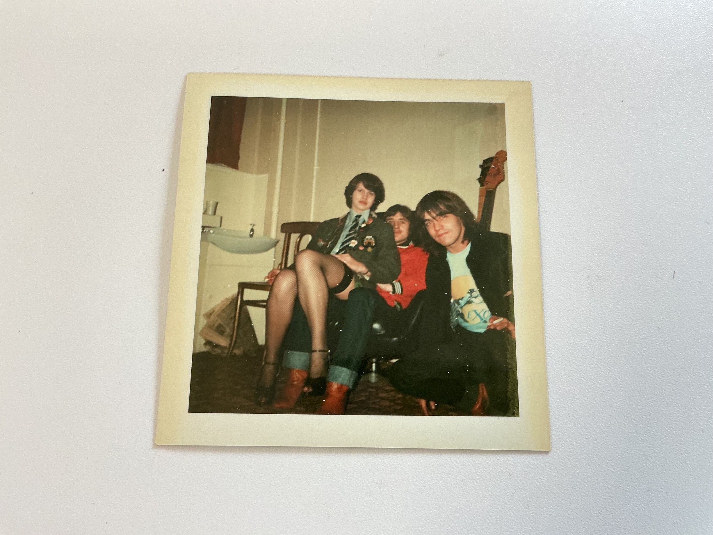 AC/DC interest. A Polaroid photo of Malcolm Young and Phil Rudd signed for the vendor when he met the band backstage at the Southampton Gaumont 7th November 1978. Further provenance available upon request.