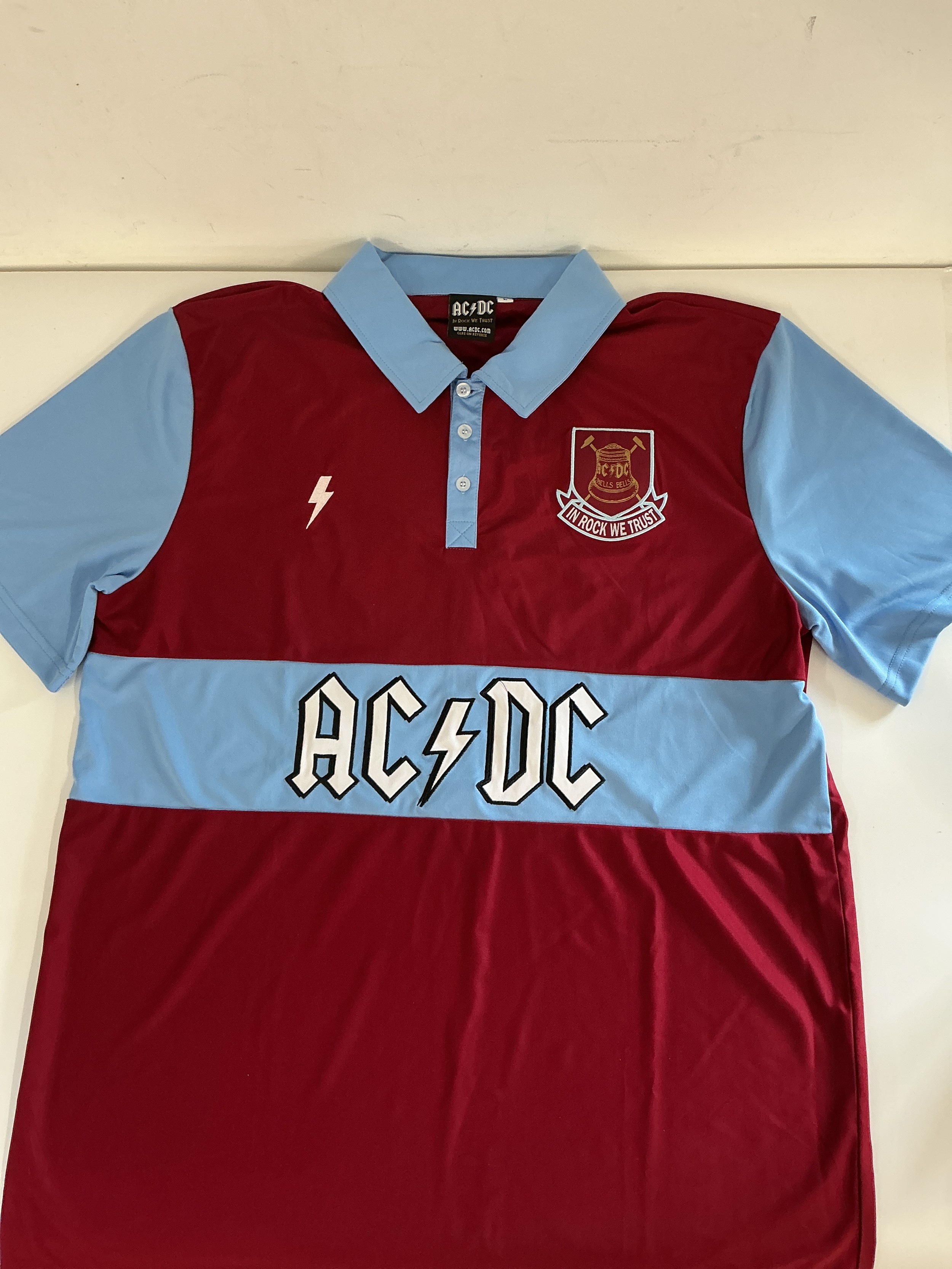 An AC/DC official merchandise West Ham Utd football shirt, size L, plus ticket and wristband from their London Stadium gig on 4th June 2016.