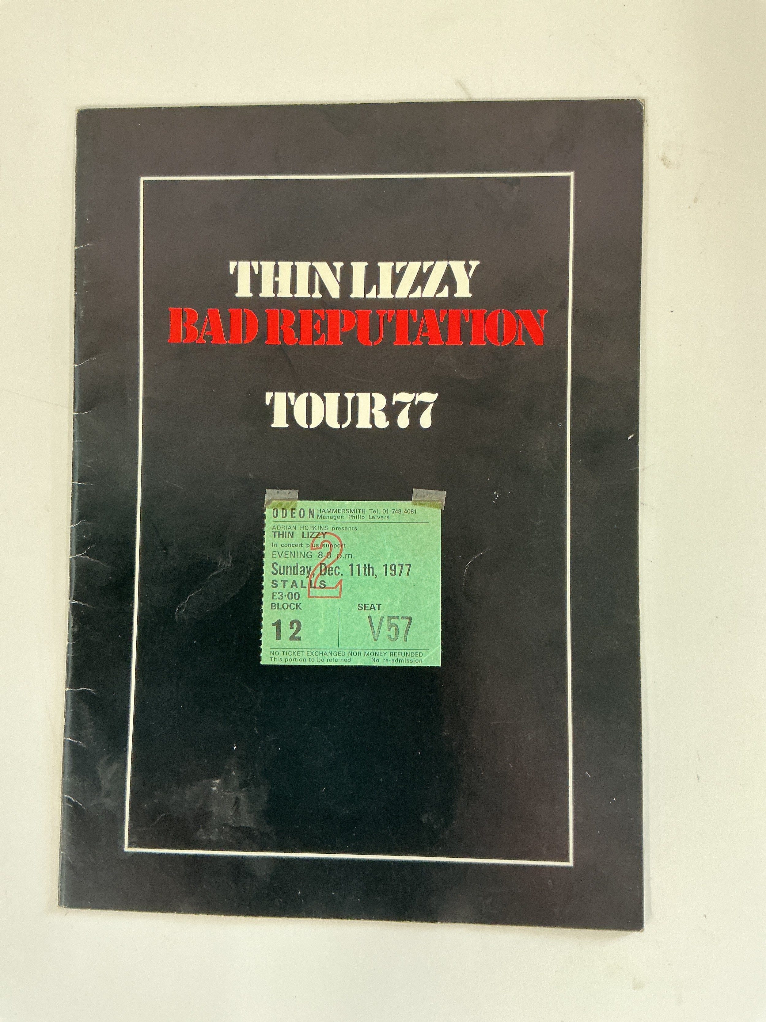 A 1977 Thin Lizzy Bad Reputation tour program and ticket plus a Downtown Records of Romford shop display, approx 98cm x 68cm.