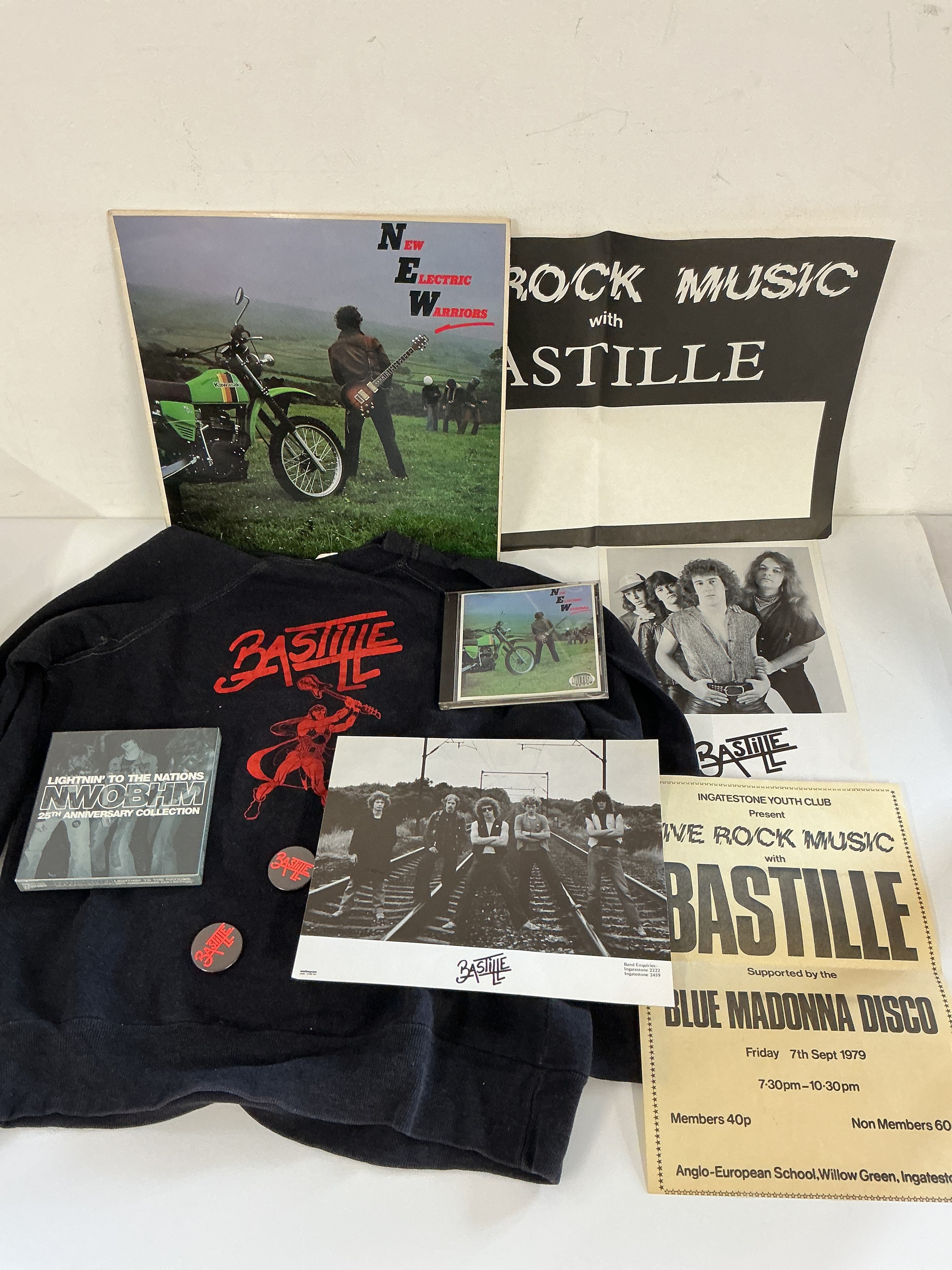 A collection of New Wave of British Heavy Metal items including a rare Lightnin' To The Nations 3CD compilation, New Electric Warriors CD and LP, two posters, Bastille publicity items etc.