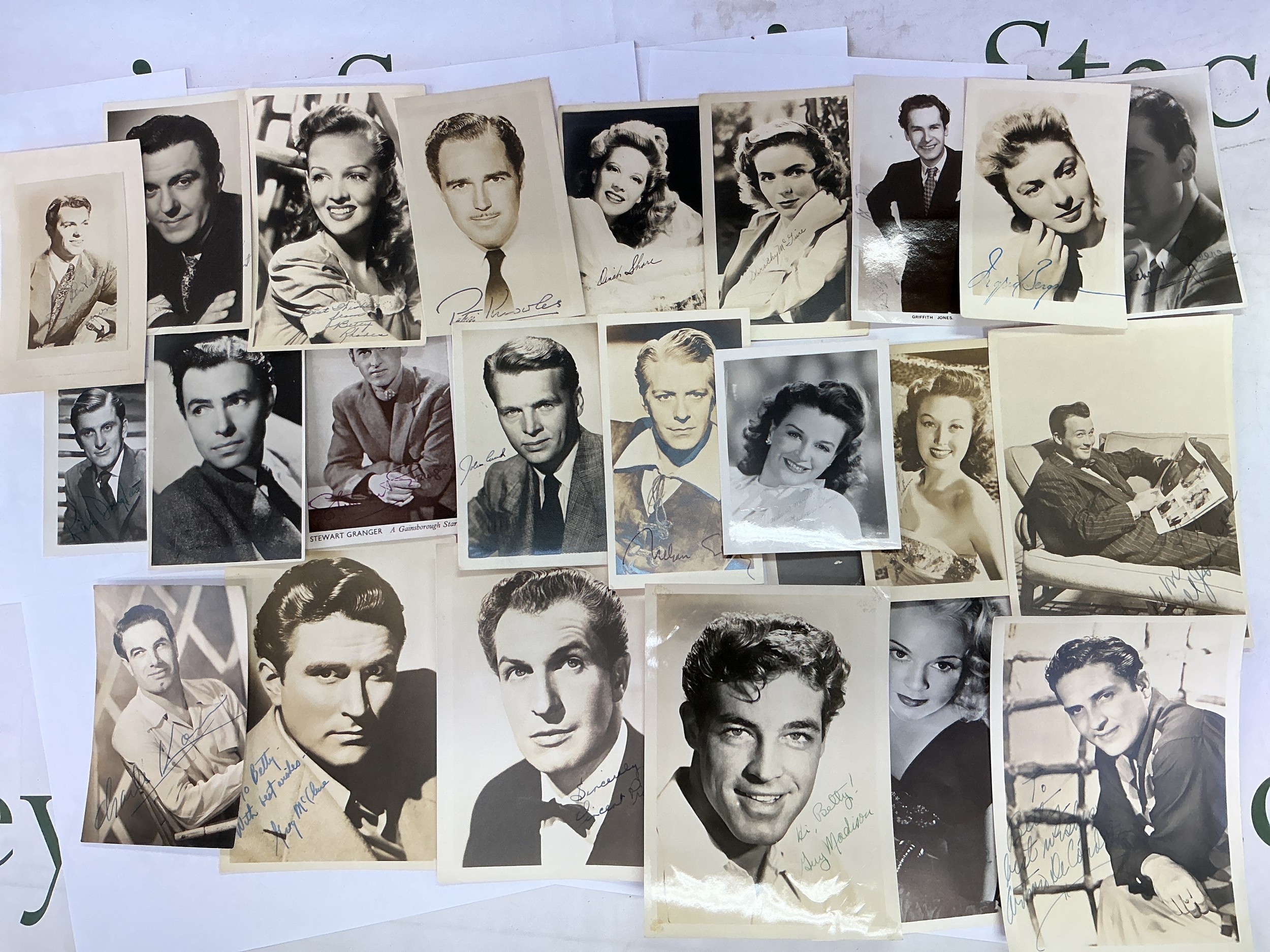 An extensive collection of vintage film star postcards, some signed, some autopen examples. Names include Kirk Douglas, Vincent Price, James Mason, Ingrid Bergman and many more.
