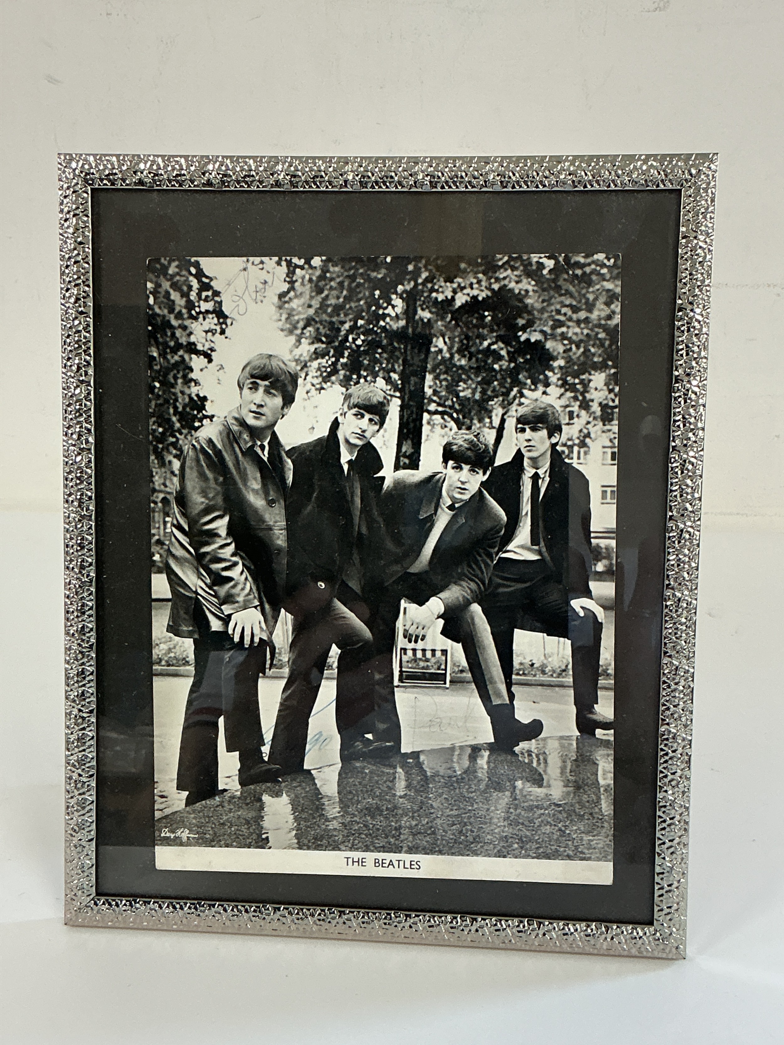 A signed Beatles publicity card. Unusually signed with just their first names the photo was given to the vendor's father by either Brian Epstein or Neil Aspinall whilst he was working as a travel executive for BEA in the 1960s. Sadly no further evidence of authenticity exists. Please note that potential bidders must be happy as to the authenticity of this item before bidding as we will not refund this item should it prove to be anything other than genuine.