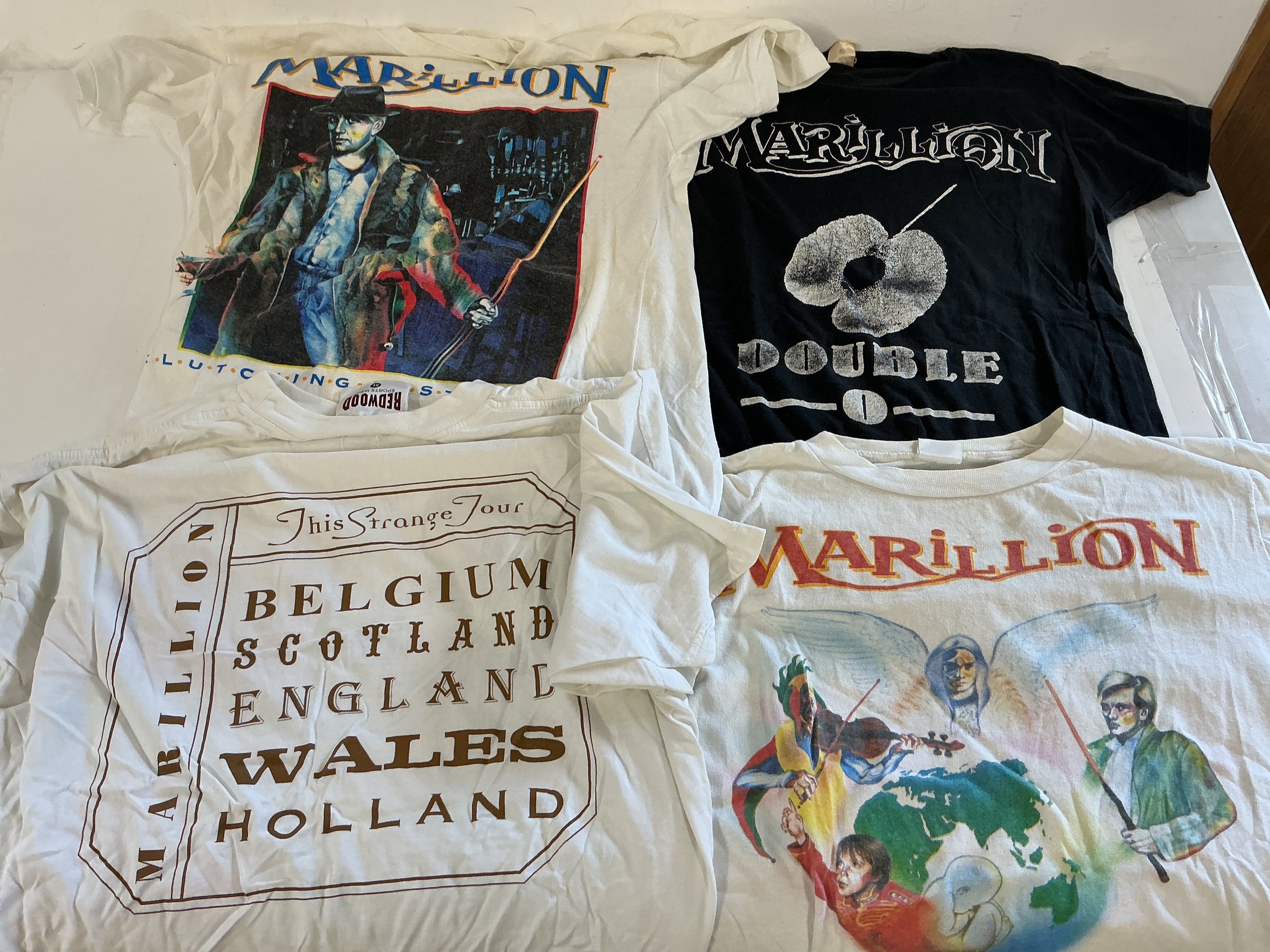 A collection of 15 Marillion tour T shirts and two scarves. See images for list.
