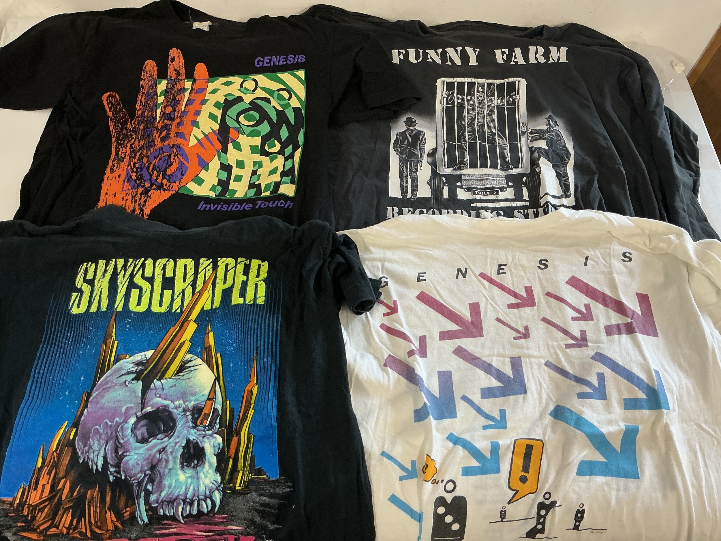 A collection of band t shirts for various artists including Genesis, Fish and others. Please see images for list.