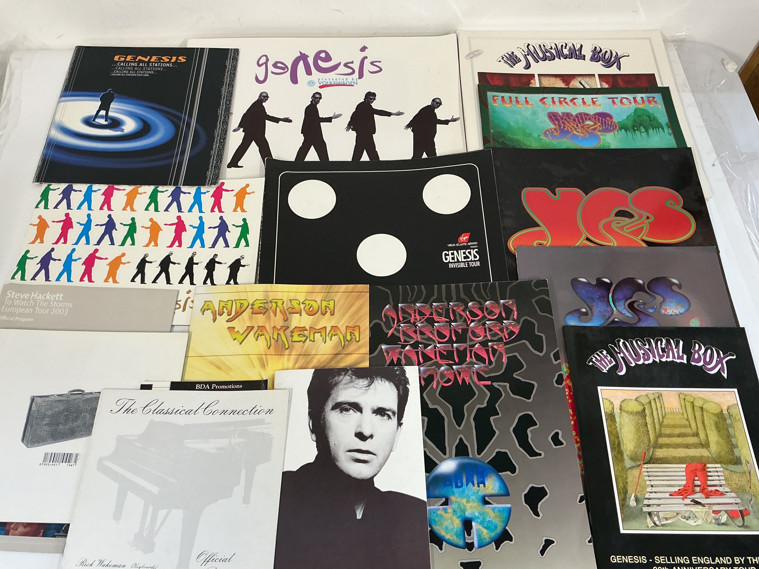 Sixteen prog rock tour programs for various artists including Genesis, Yes, Steve Hackett and others. Includes a Steve and John Hackett signed Momentum program.