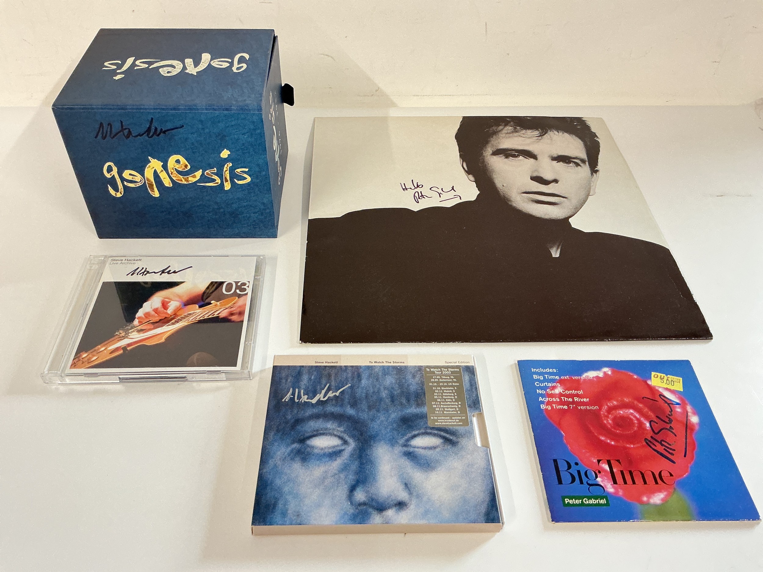 Genesis interest. Five items signed either by Peter Gabriel or Steve Hackett comprising LPs and CDs.