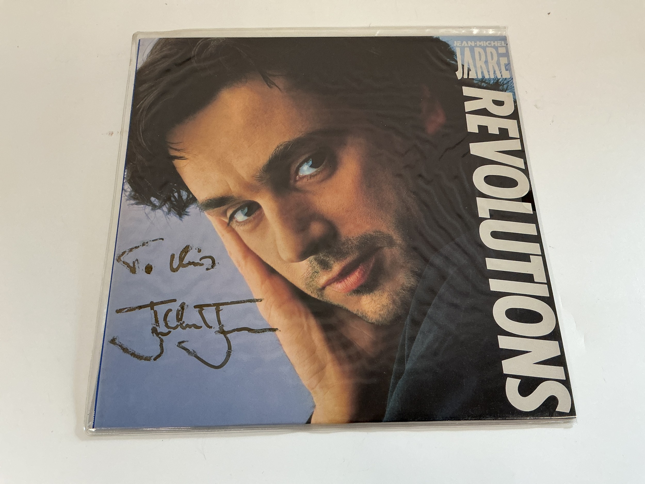 A signed Jean Michel Jarre Revolutions LP.