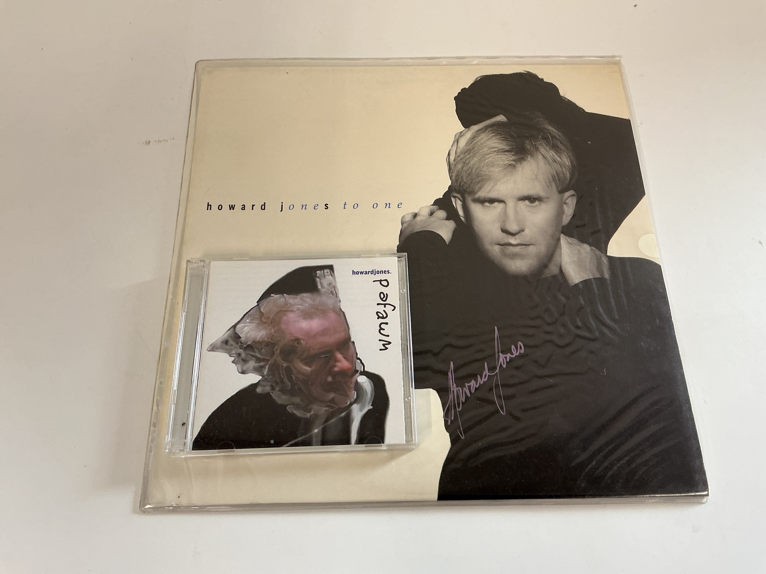 A signed Howard Jones One To One LP and a limited edition CD set (2).