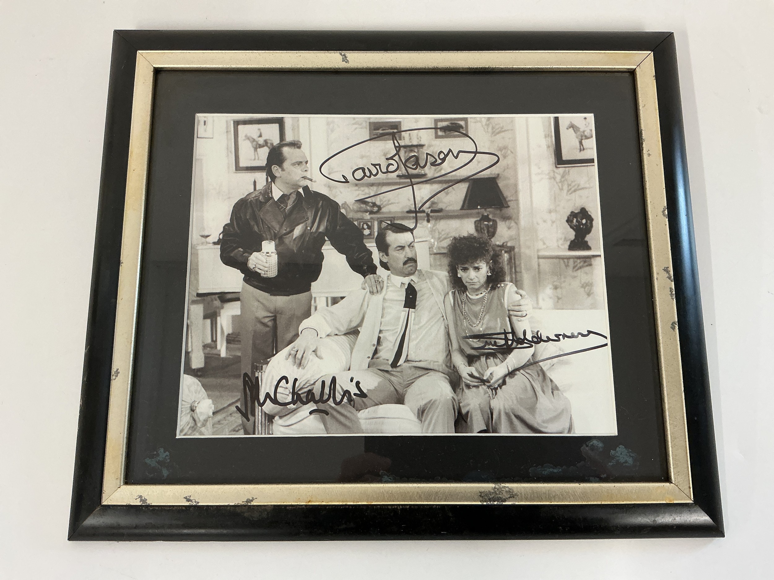 A signed Only Fools & Horses photo bearing the signatures of David Jason, John Challis and Sue Holderness. Comes with COA.