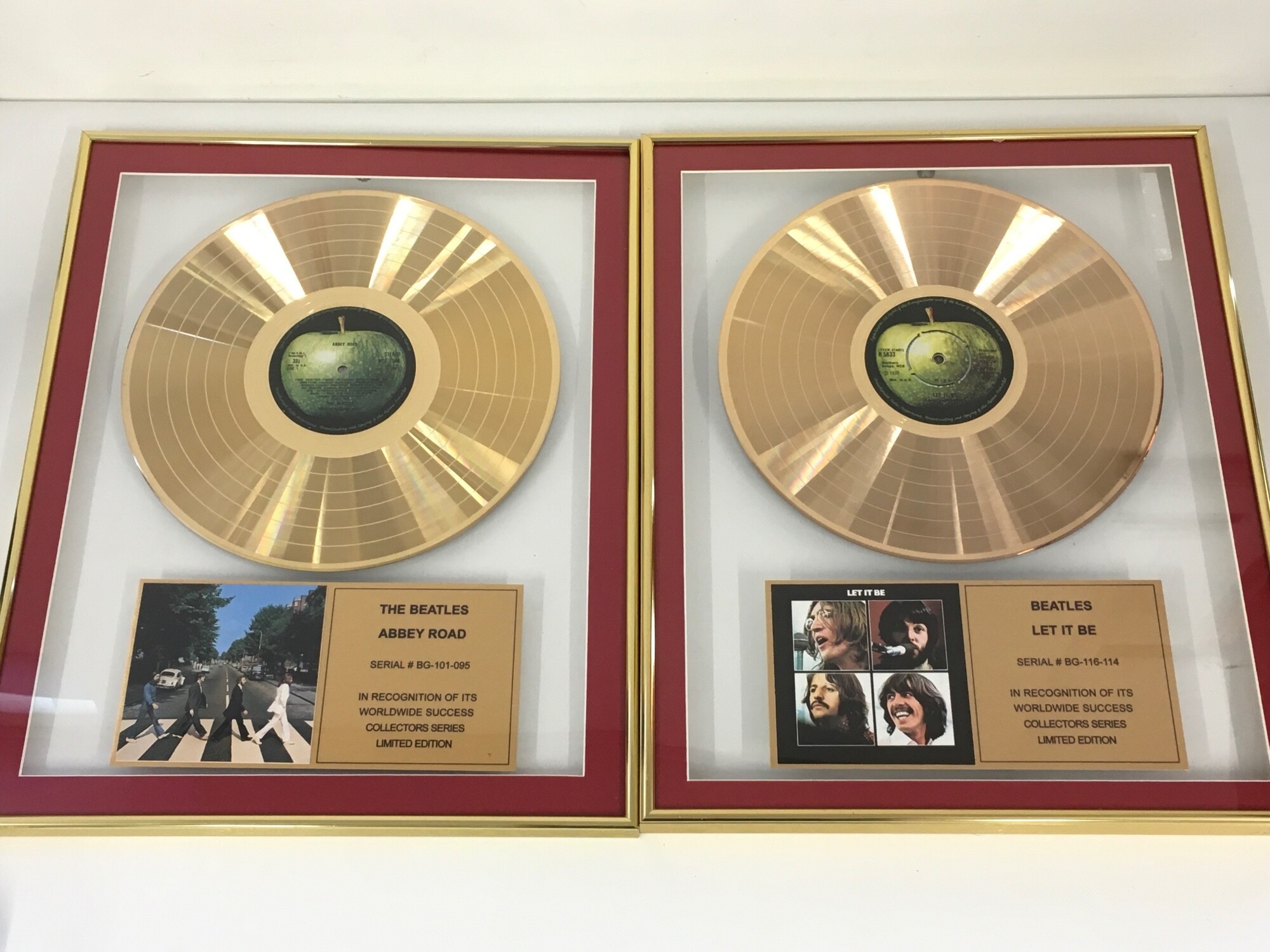 Two framed and limited edition Beatles gold discs comprising Abbey Road and Let It Be, both approx 41cm x 52cm.