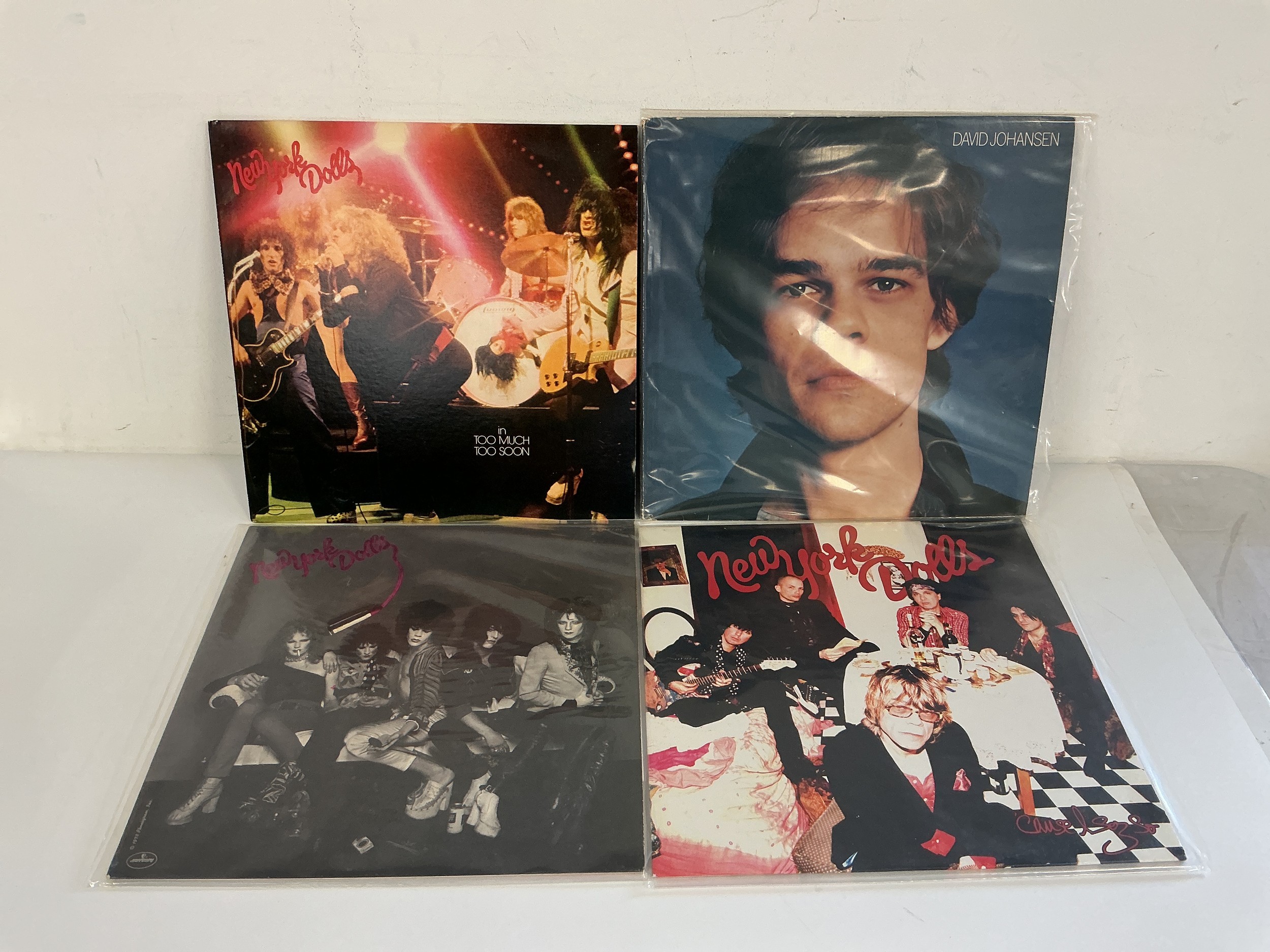 Four New York Dolls and related LPs comprising a 180g pressing of their self titled debut, In Too Much Too Soon, Cause I Sez So and the self titled David Johansen solo LP.