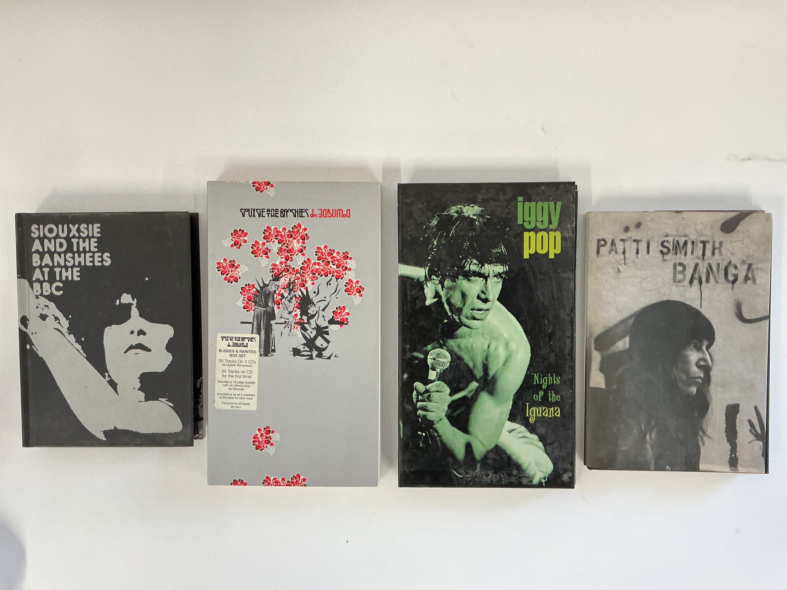 Four CD long boxes comprising Nights Of The Iguana by Iggy Pop, two by Siouxsie & The Banshees and Banga by Patti Smith.