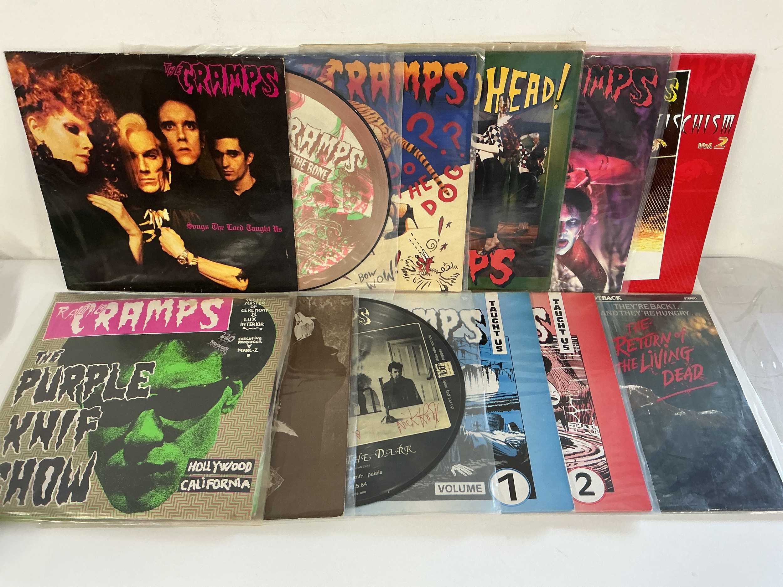 Twelve LPs by The Cramps comprising Songs The Lord Taught Us, Off The Bone picture disc, Look Mom No Head and others.
