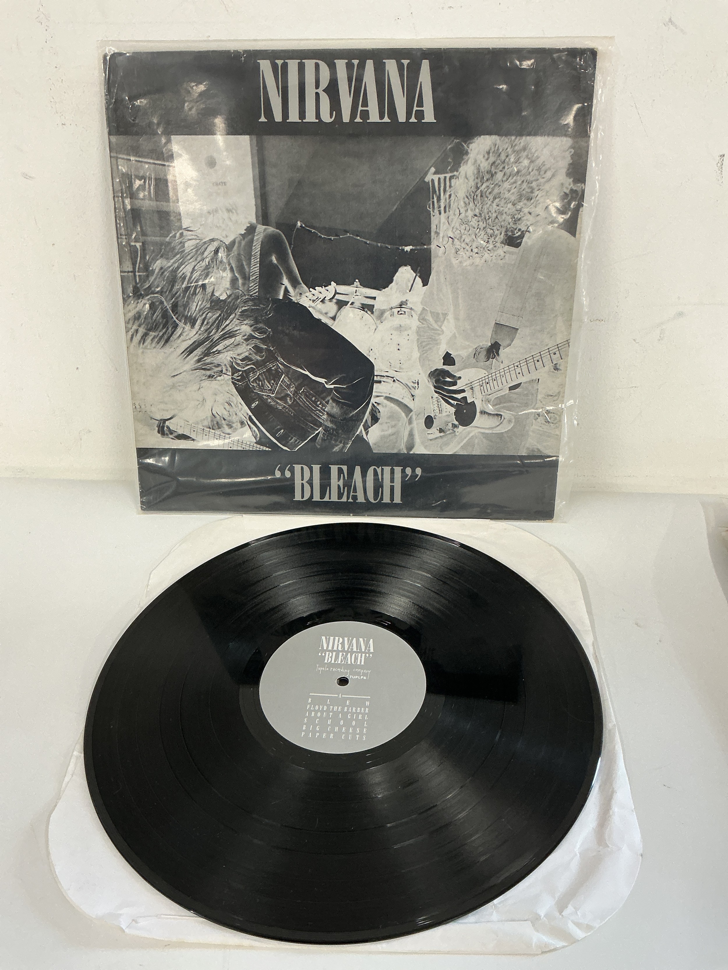 A first UK pressing of the debut Nirvana LP 'Bleach' TUP LP6. Vinyl EX, Sleeve VG+.