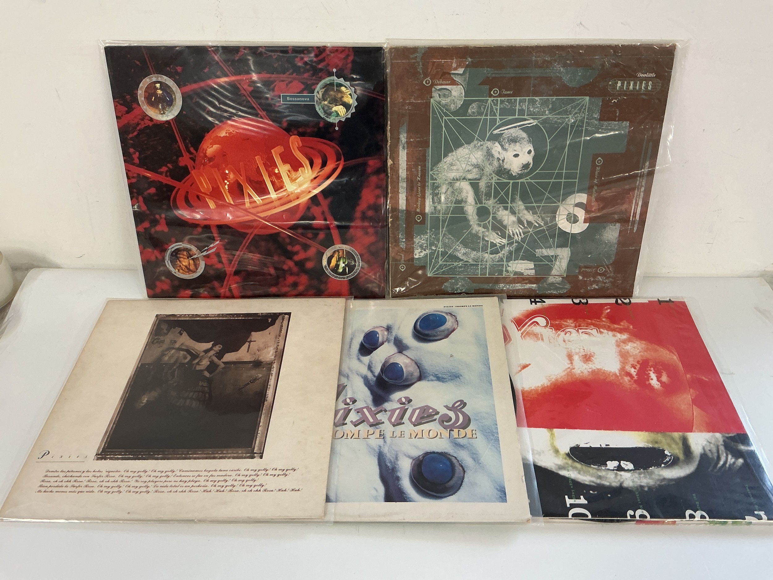 Five early UK pressings of Pixies LPs comprising Surfer Rosa, Doolittle, Bossanova and others.