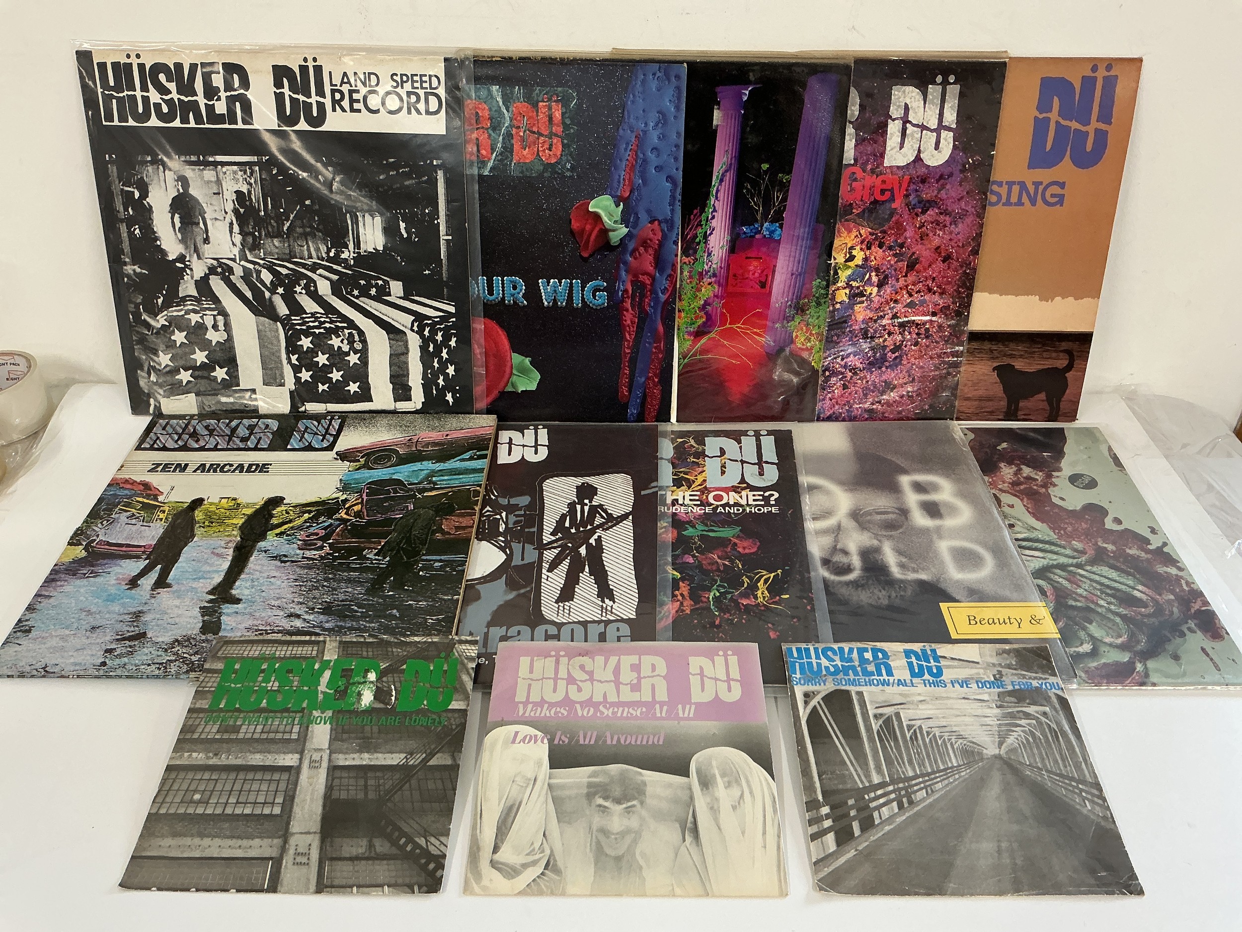 A collection of Husker Du and related LPs, 12" and 7" singles comprising Flip Your Wig, Zen Arcade, Land Speed Record and others.