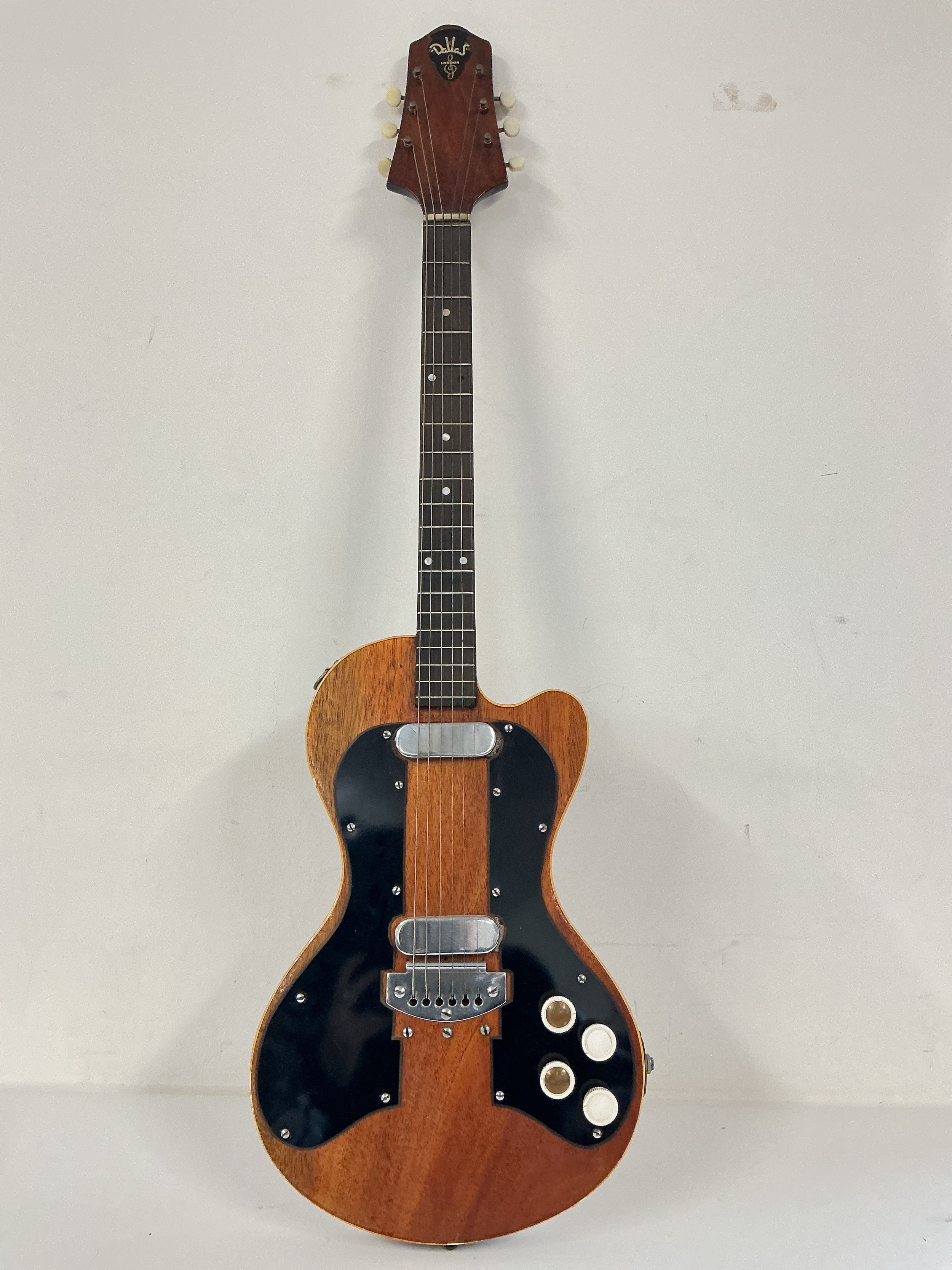 A Dallas Tuxedo double pickup model electric guitar. No case.