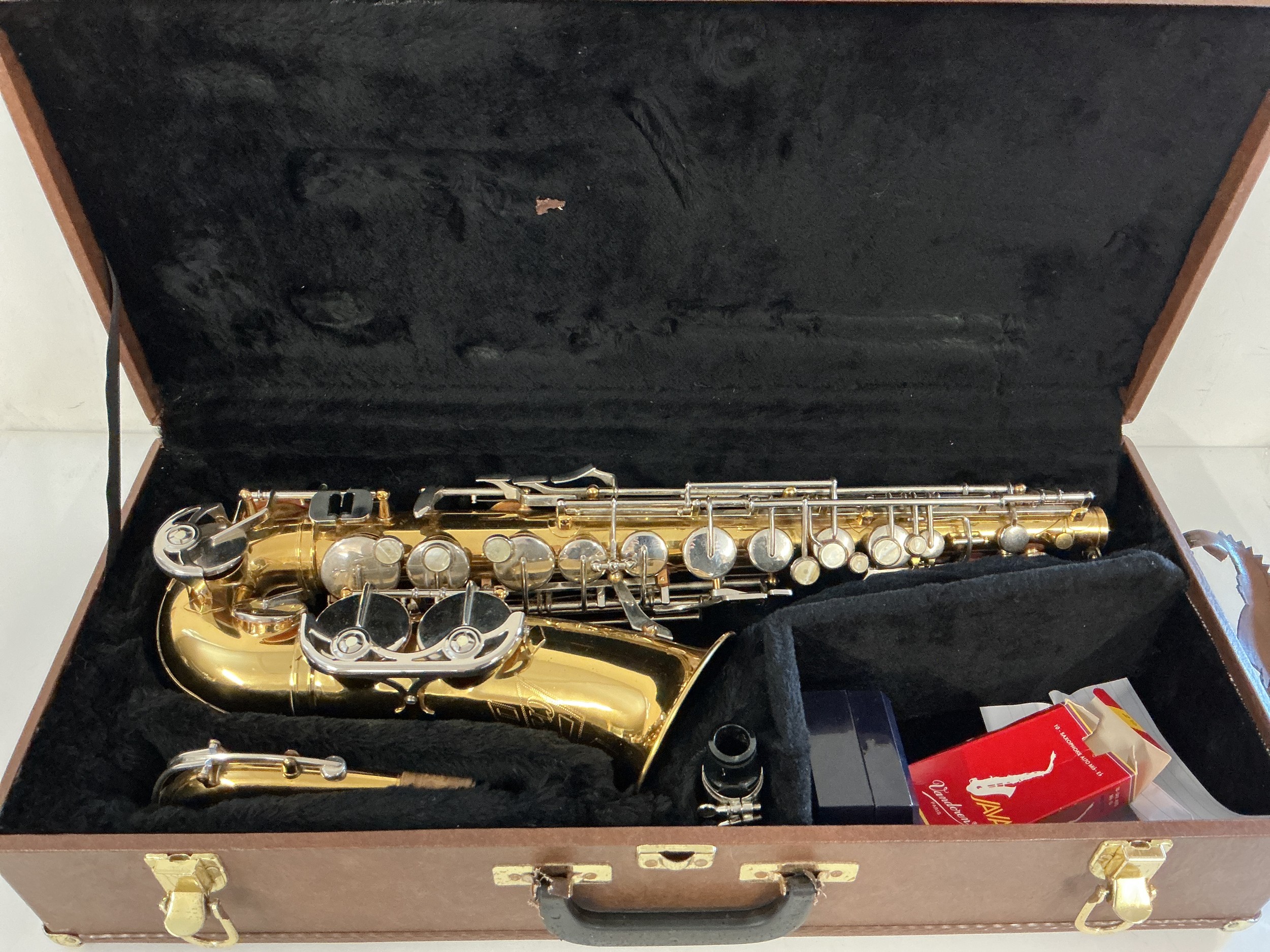 A hard cased Barnes & Mullins alto saxophone. Has recently been refurbished.