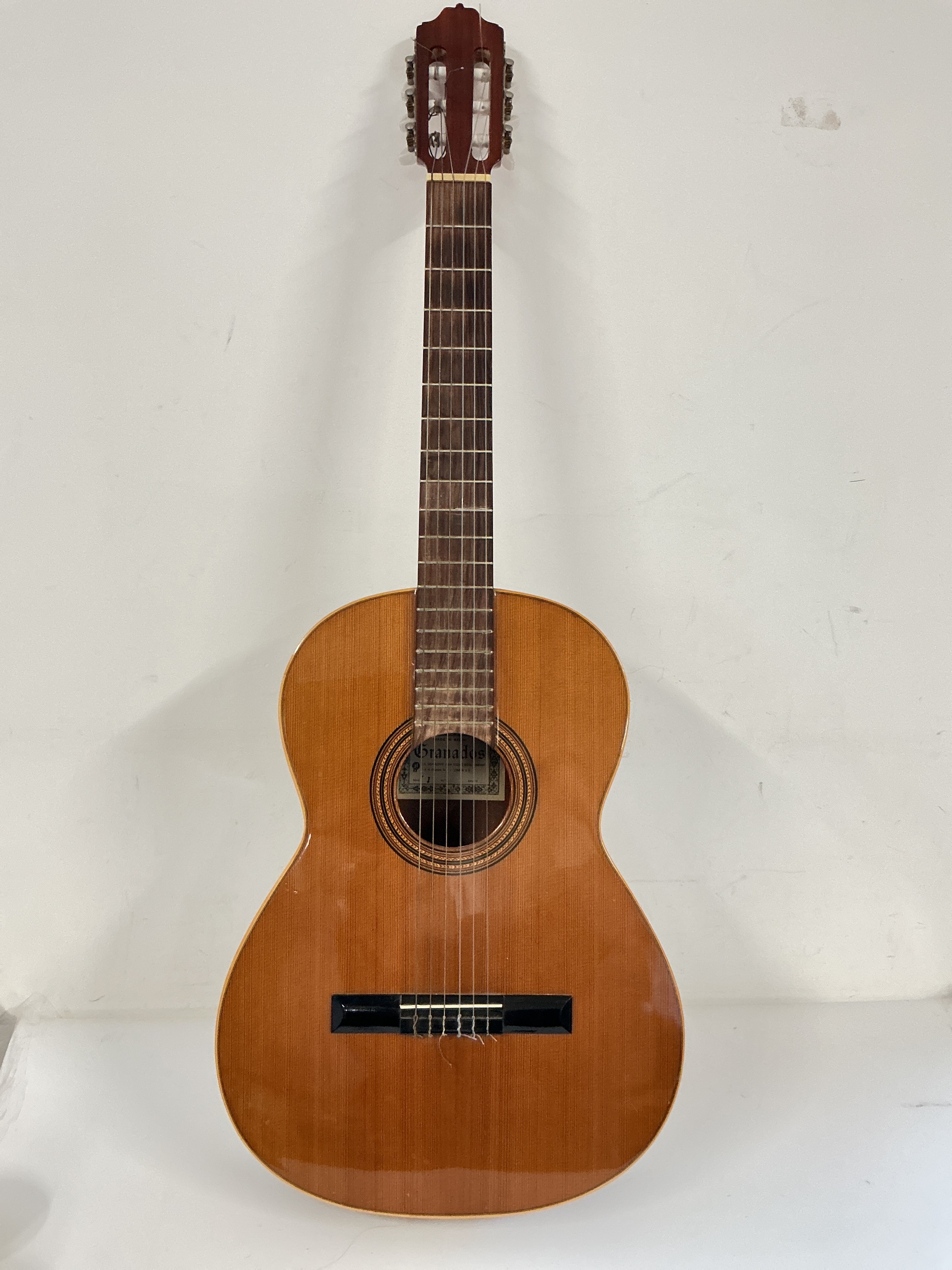 A Granados Spanish guitar, no case.