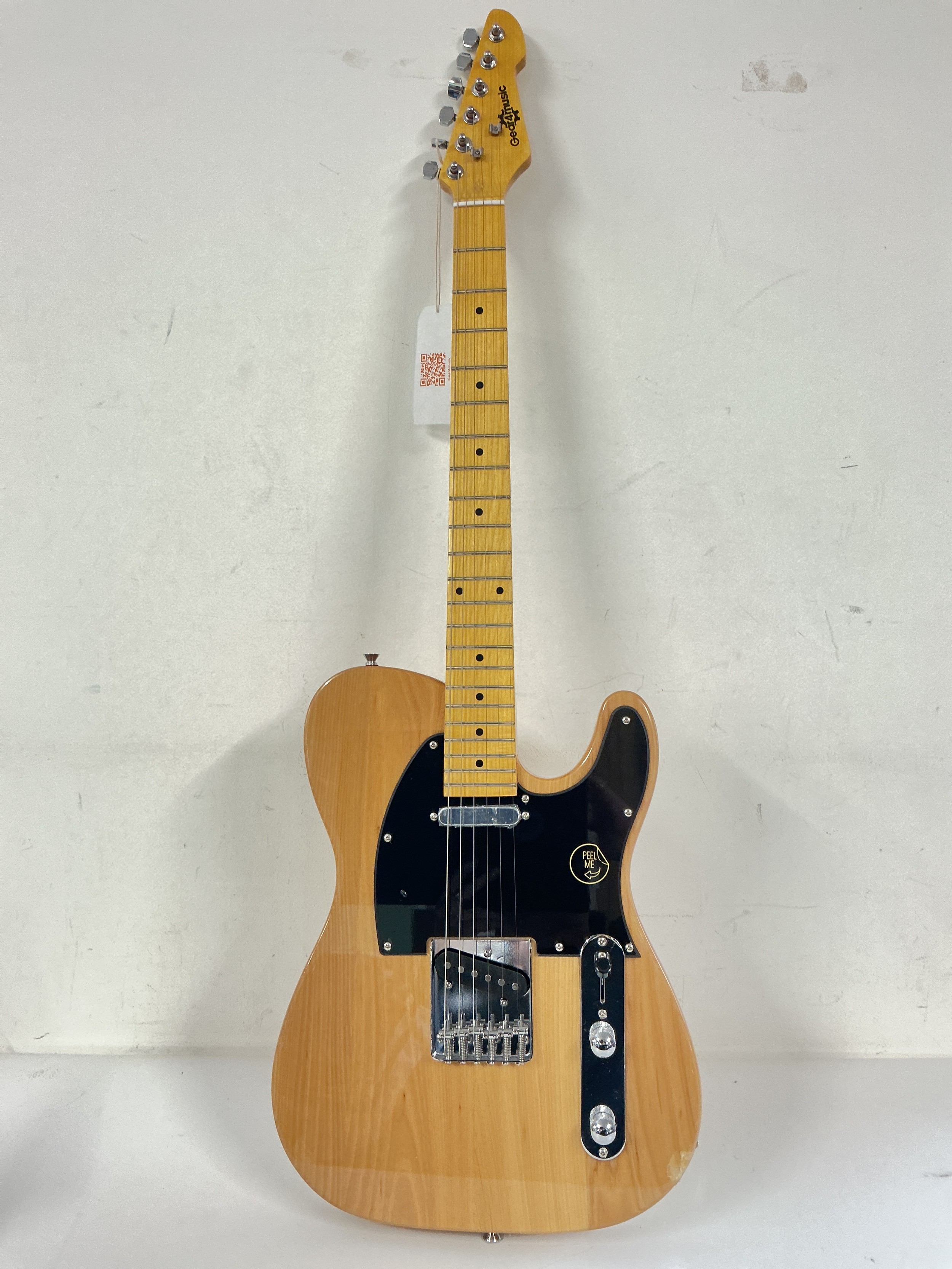 A Gear 4 Music tele style electric guitar. Comes with a soft carry case.