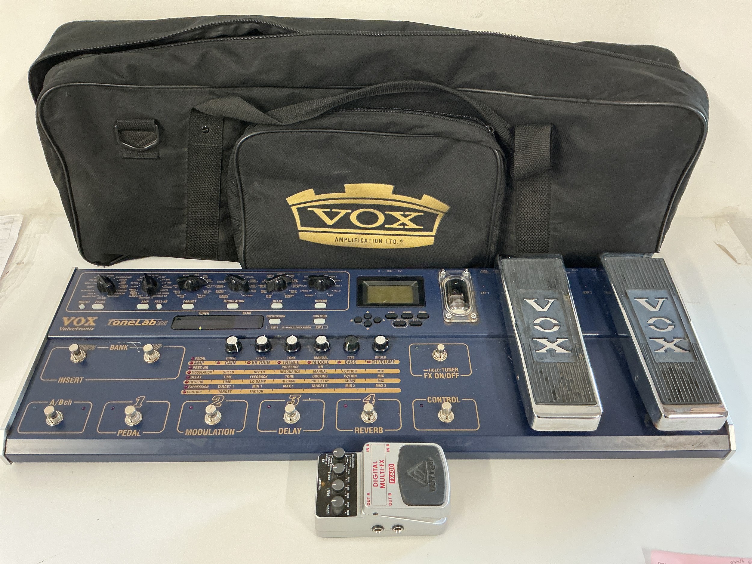 A Vox Valvetronix Tonelab SE multi effects pedal unit with original carry case and a Behringer FX600 effects pedal (2).