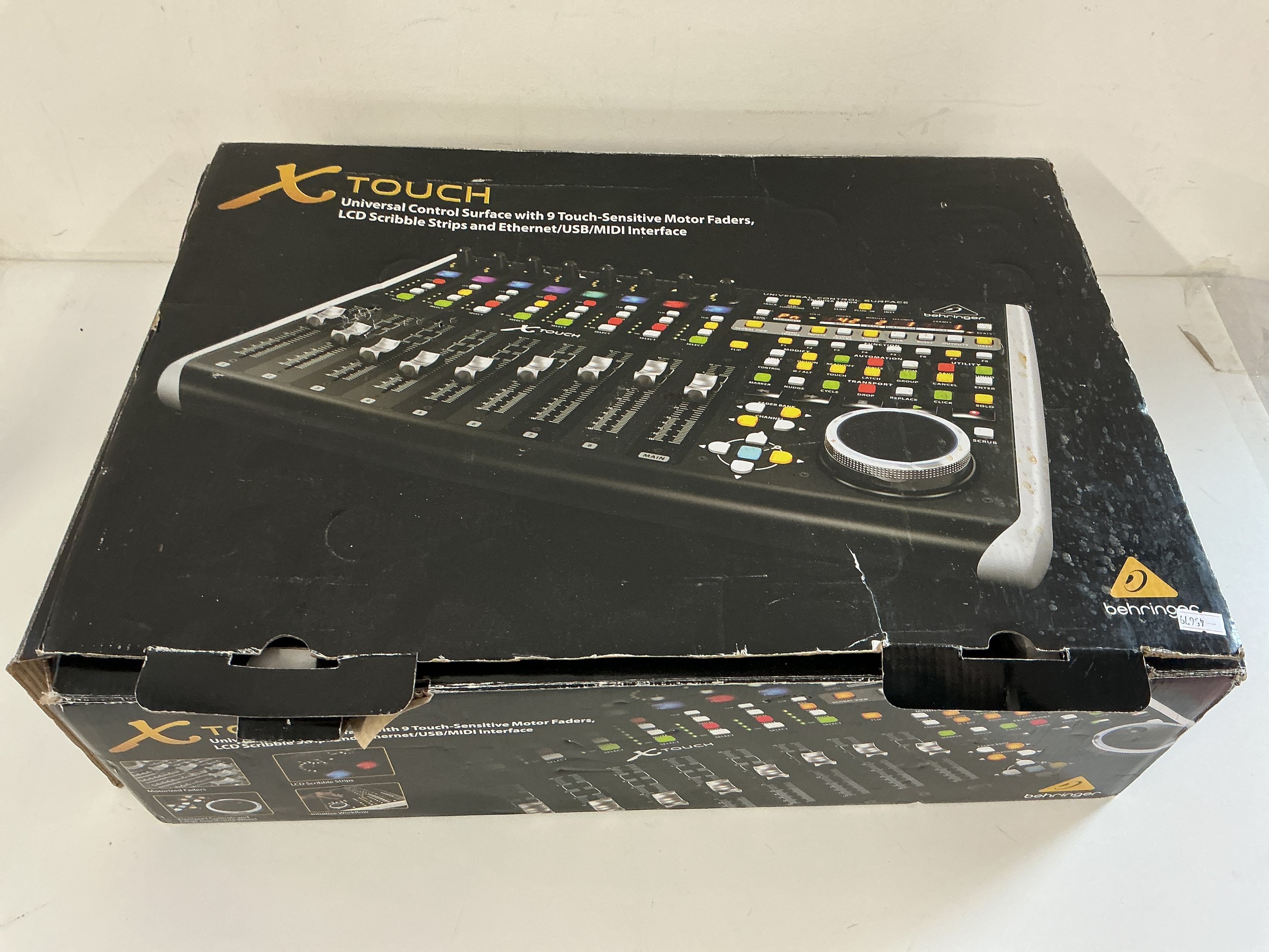 A boxed and as new Behringer X Touch DAW control workstation.
