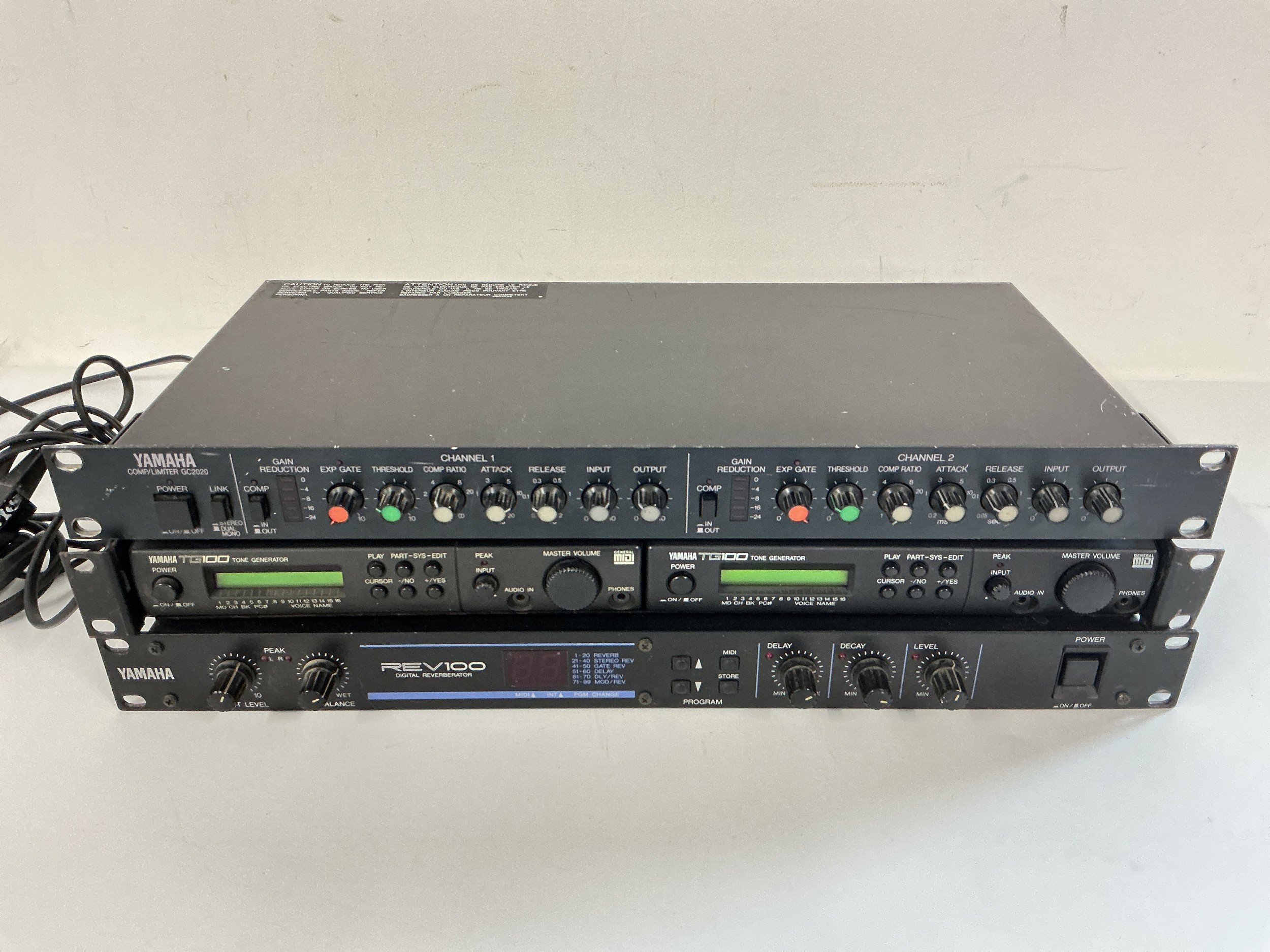Four rack effects units comprising two Yamaha TG100 tone generators, a Yamaha REV100 digital reverberator and a Yamaha GC2020 compression/limiter.