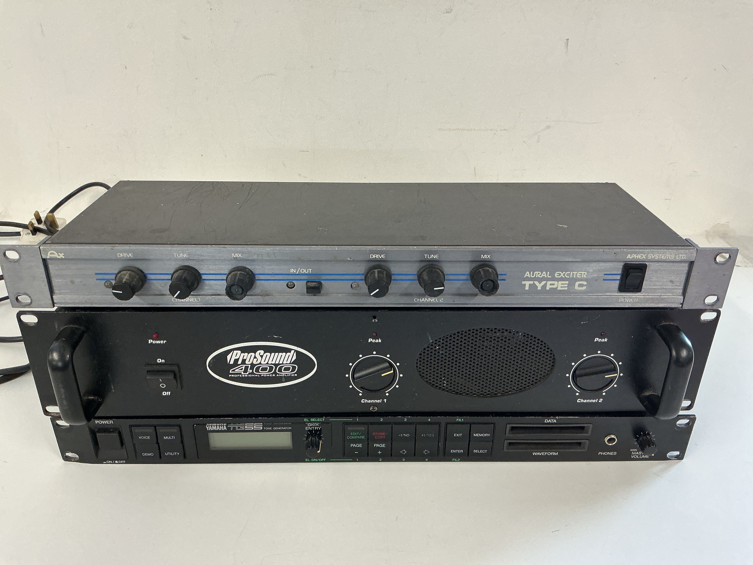 Three rack effects units comprising a Yamaha TG55 tone generator, a Pro Sound 400 power amp and an Aphex Aural Exciter Type C.