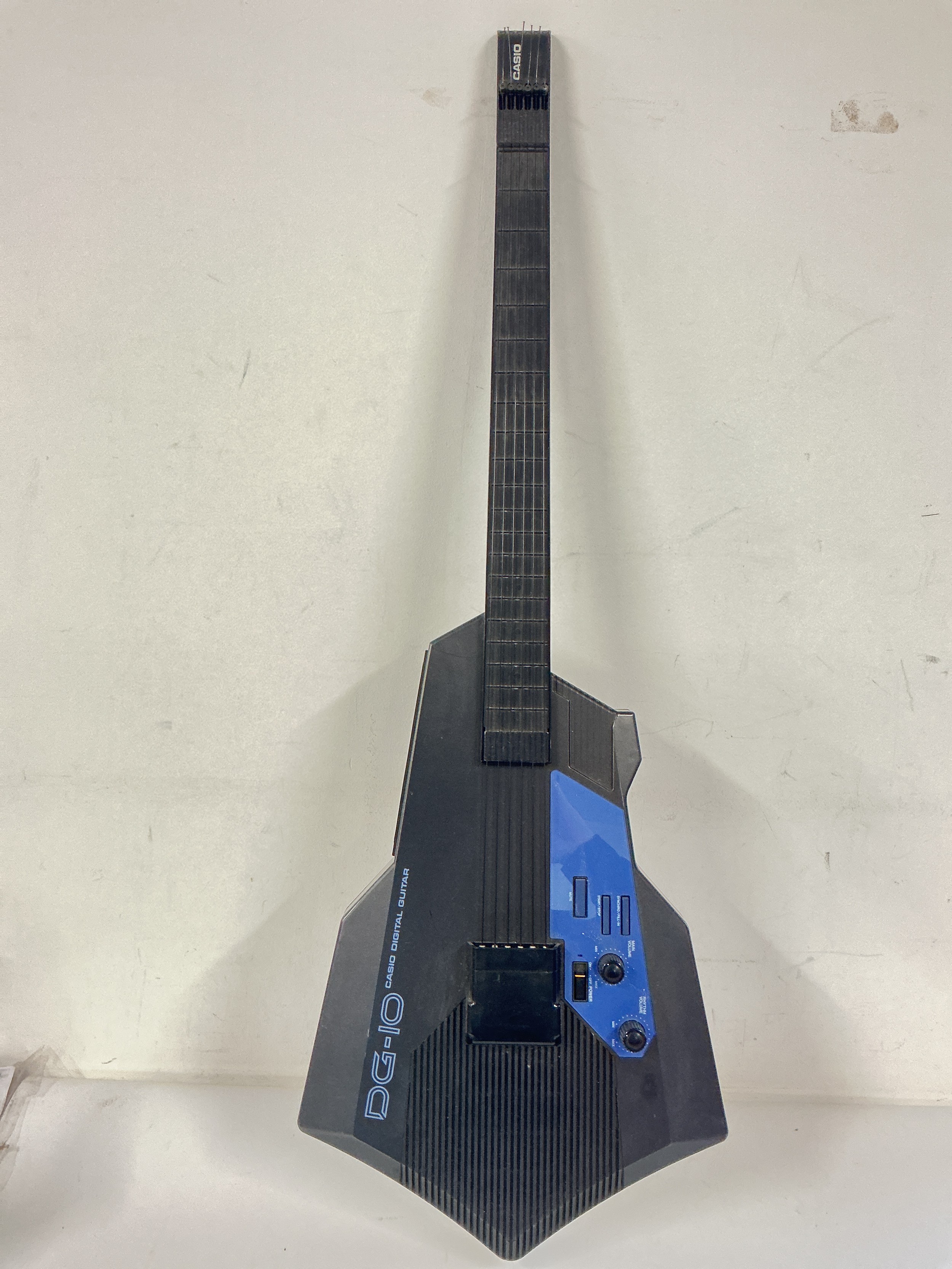 A Casio DG-10 digital guitar, no case.