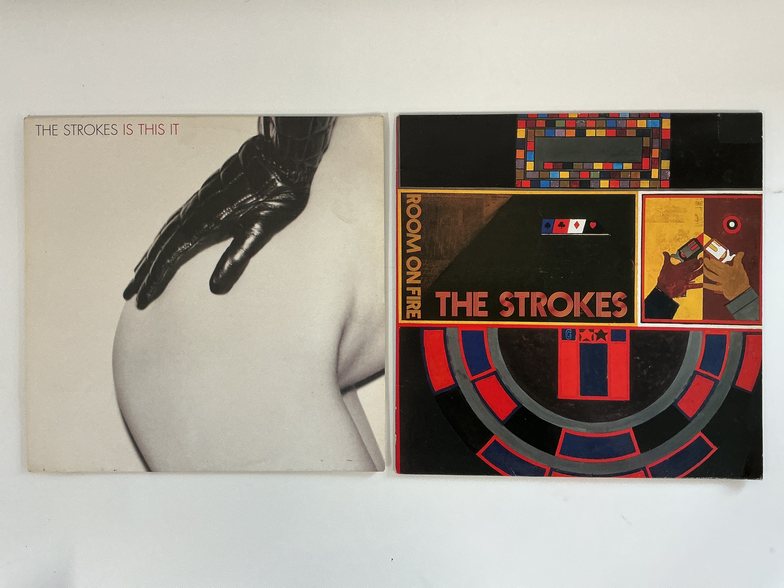 Two early UK pressings of The Strokes LPs Is This It and Room On Fire. Vinyl EX.