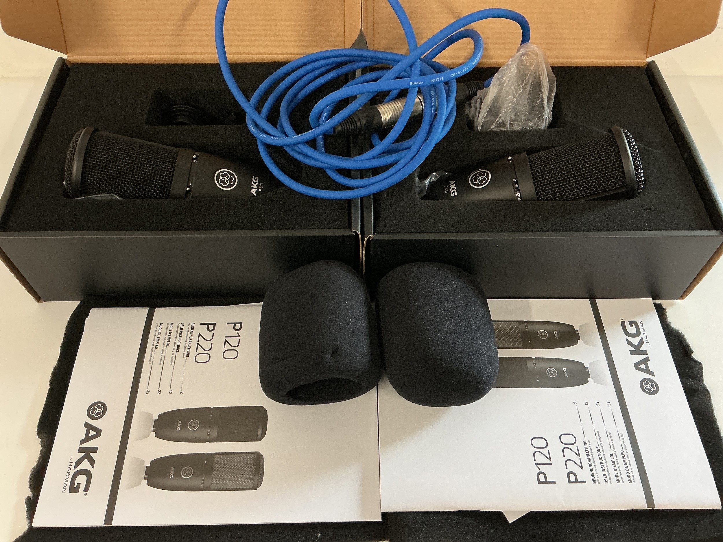 Two boxed and as new AKG P120 microphones with pop shields and cable.