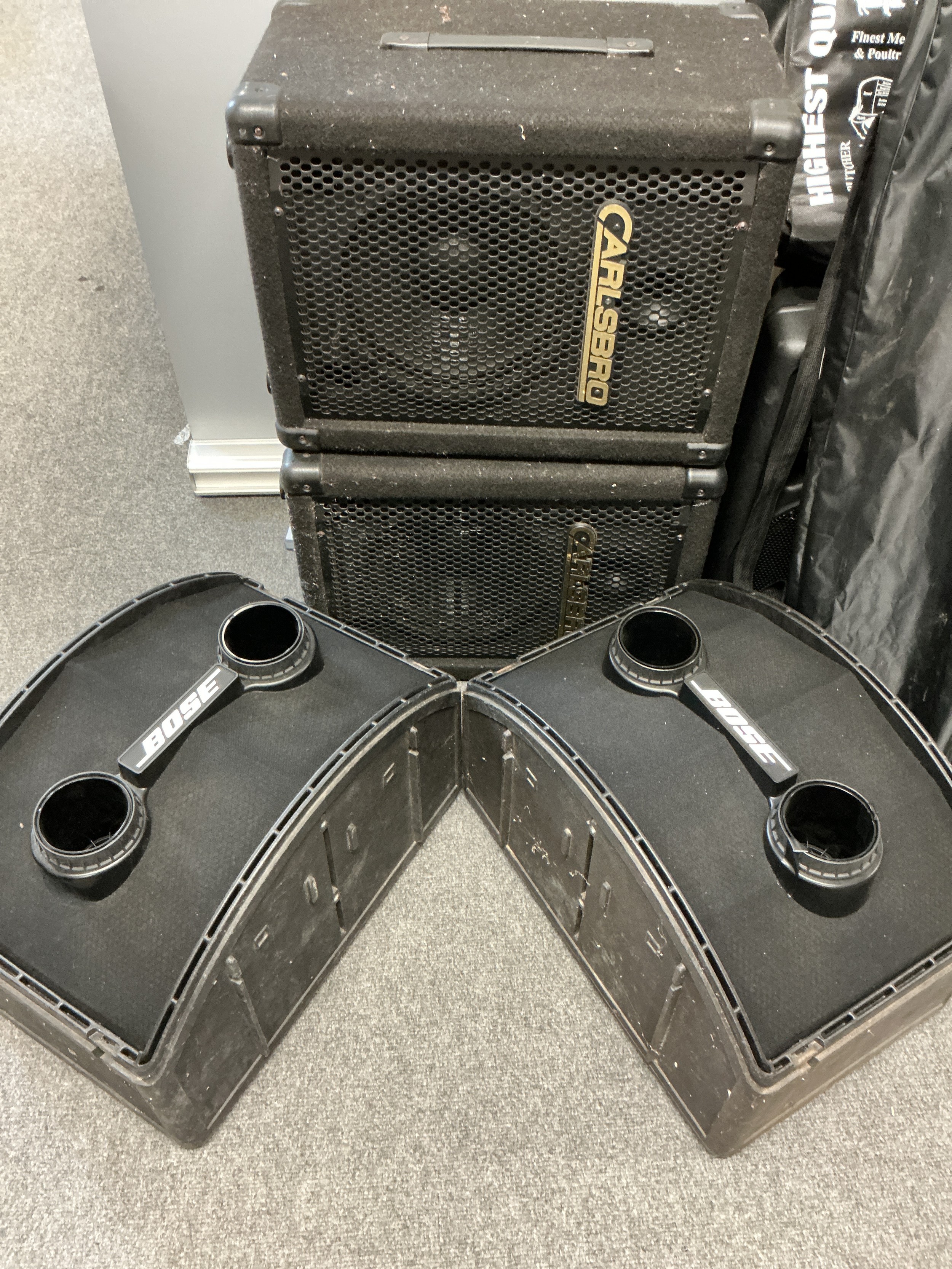 Two pairs of speakers comprising Bose and Carlsbro examples.