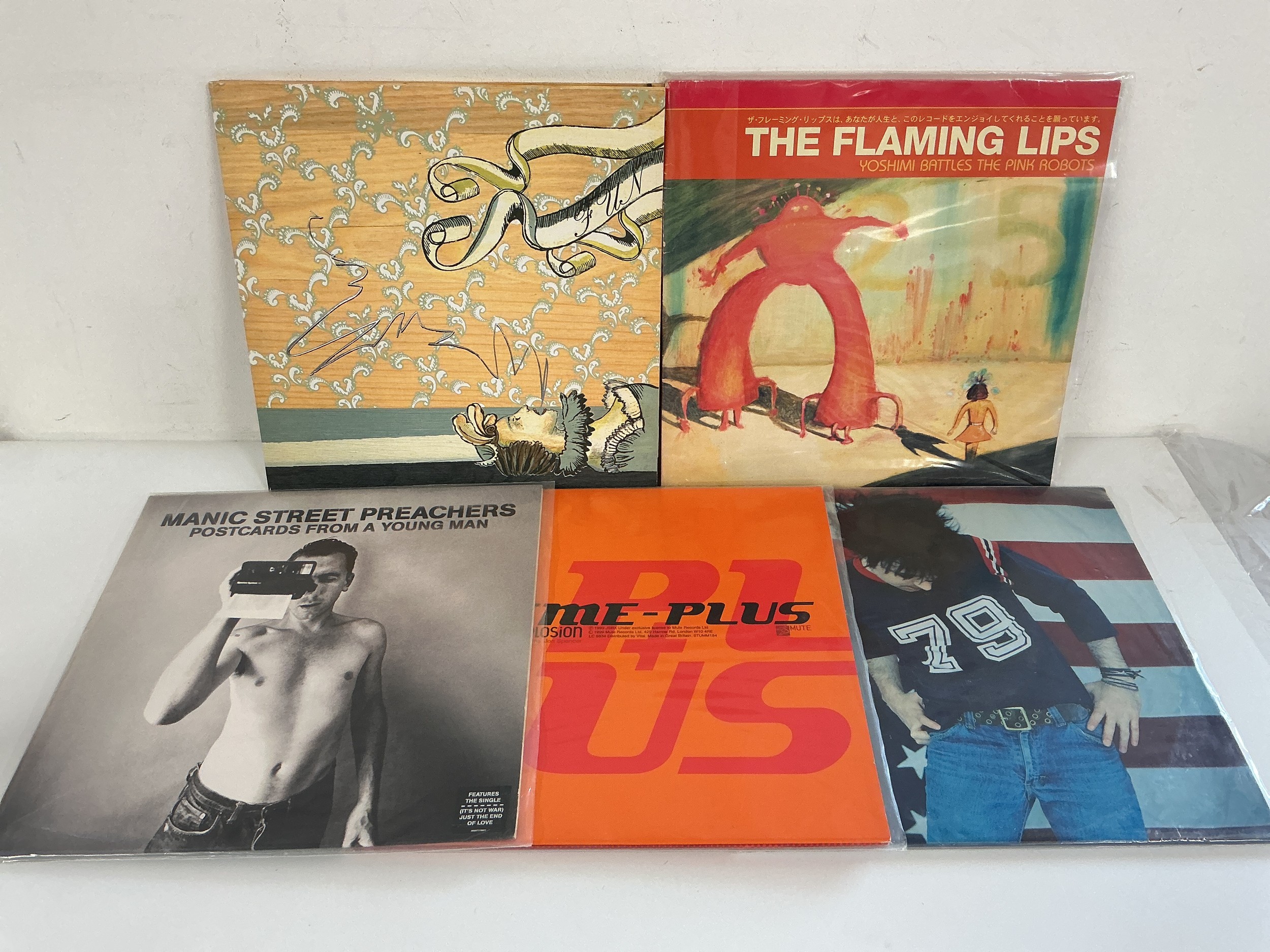 Five alt rock LPs by various artists including Manic Street Preachers, Arcade Fire, The Flaming Lips and others.
