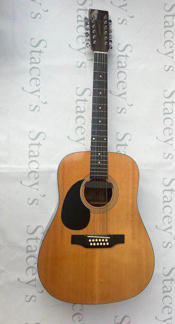 A Tanglewood TW1200 12 string left handed acoustic guitar with added Fishman sound hole pickup. In very good overall condition with no marking and light fret wear.