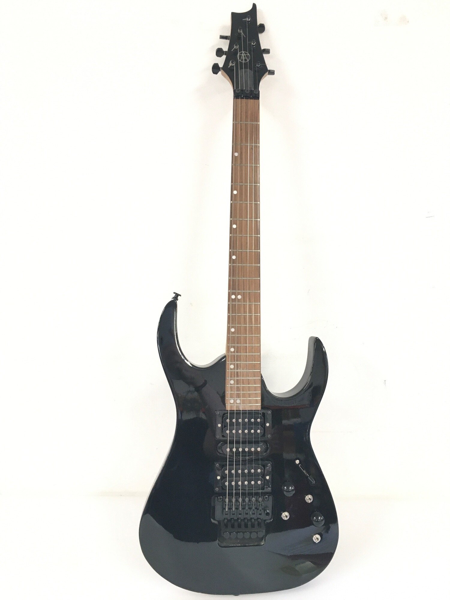 A Tao BMI 212-MB00 electric guitar with built in effects and a hard carry case.