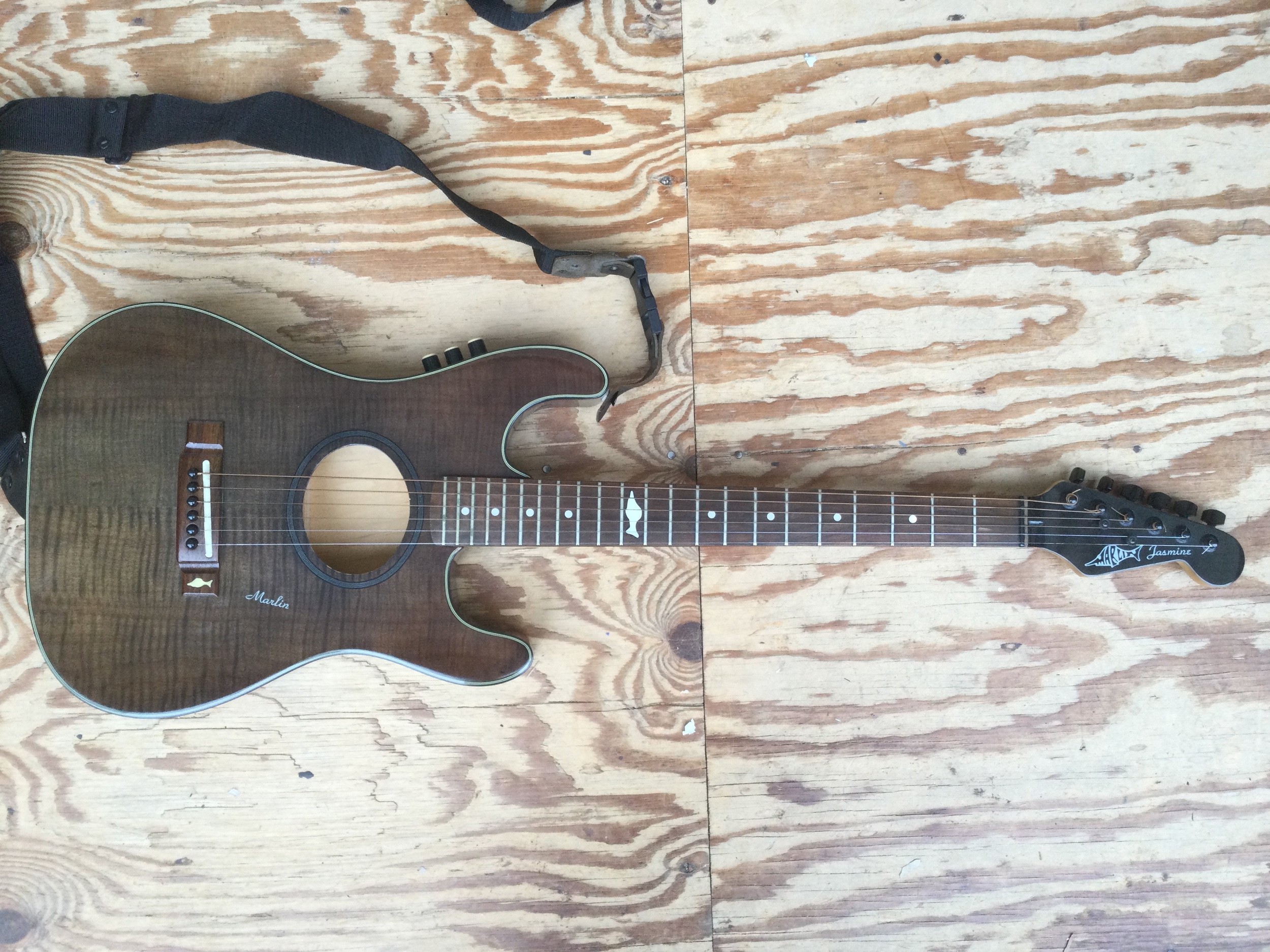 A Marlin Jasmine electro acoustic guitar. Comes with a soft carry case.