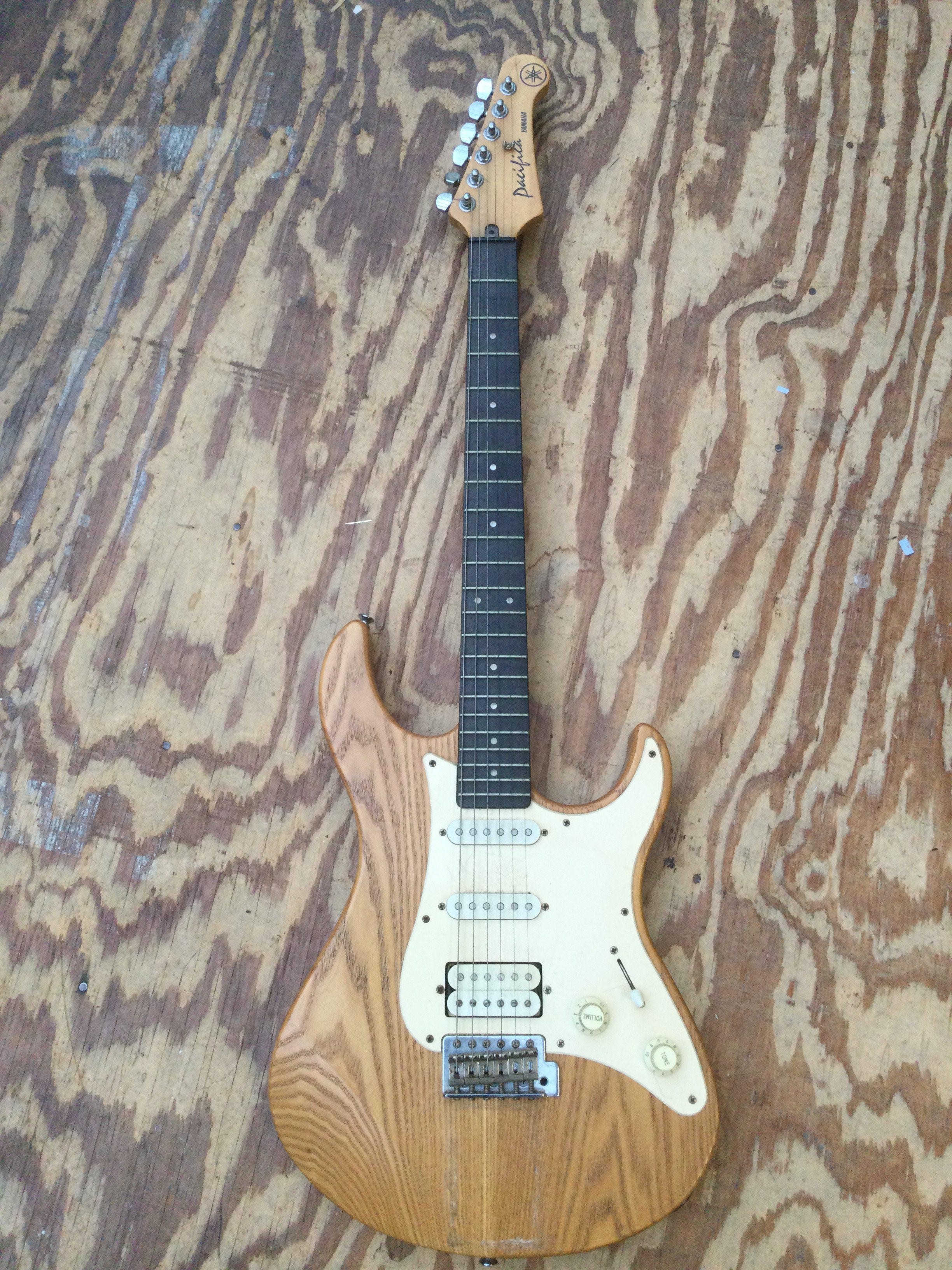 A Yamaha Pacifica electric guitar. No case.