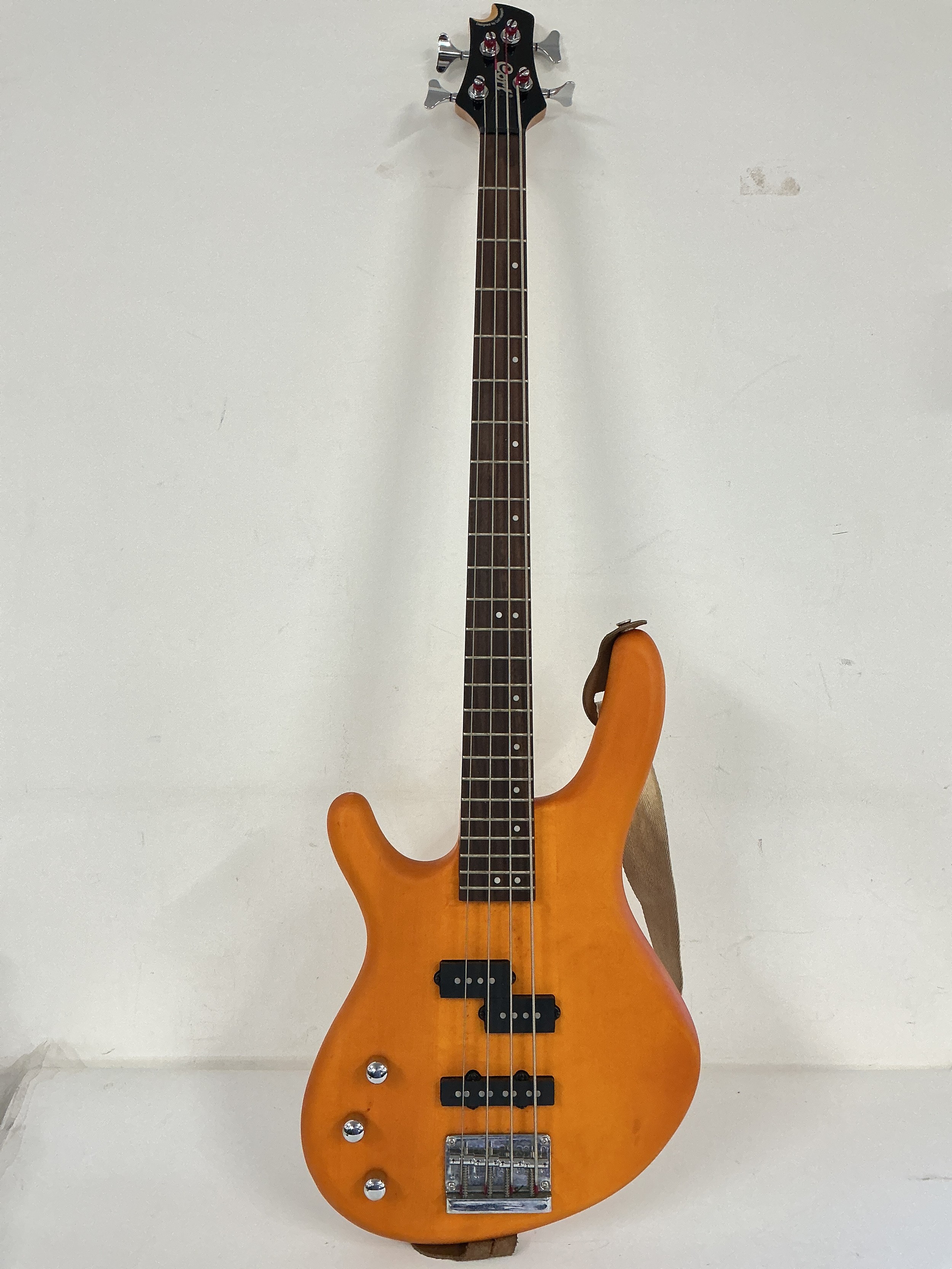 A left handed Cort Action bass guitar, no case.