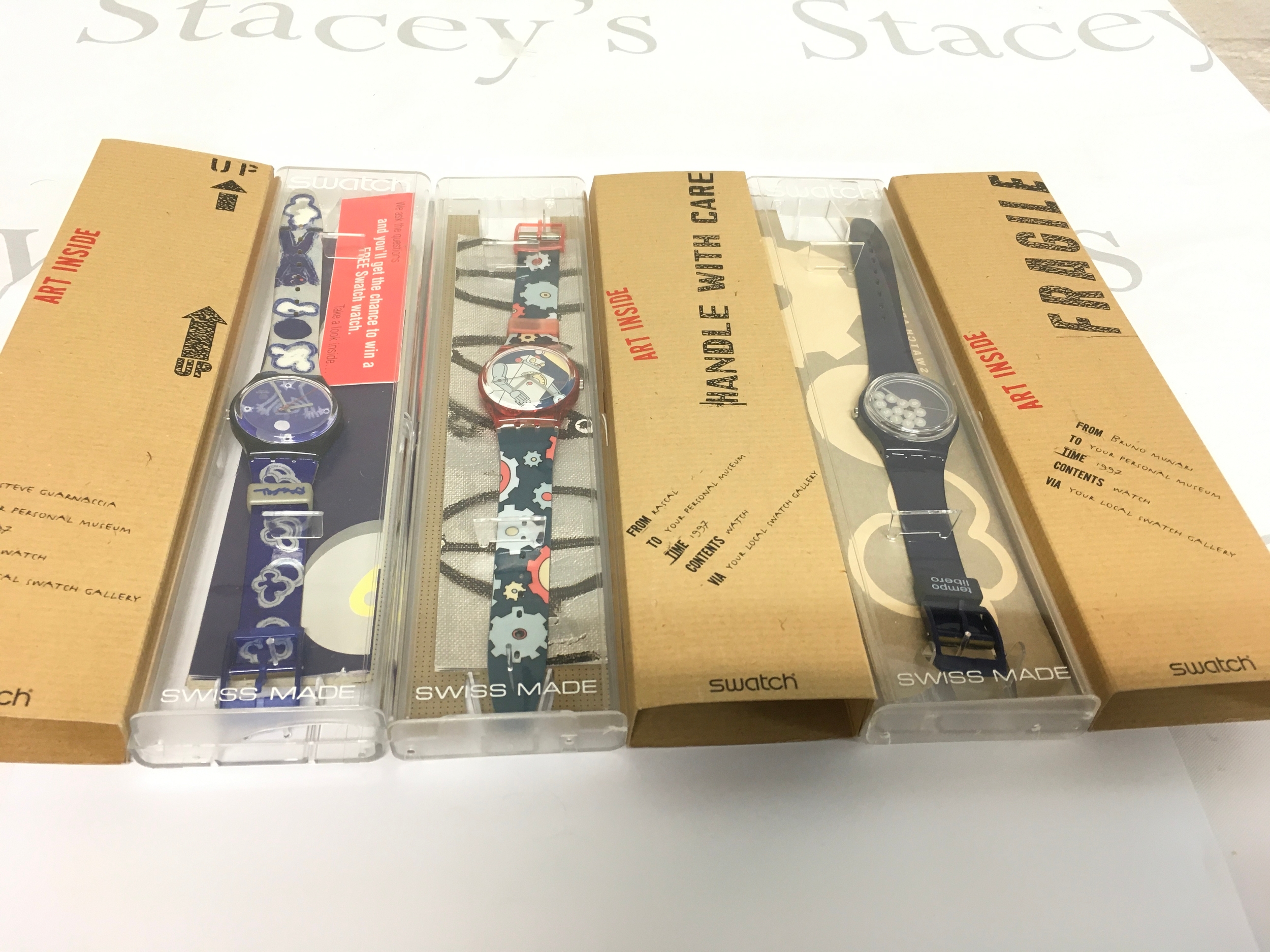 multiple vintage watches from the 1997 Swatch Artist Collection. Including Steve Guarnaccia's "Roboboy" (GR135), Rascal's "Moonchild" (GN173), and Bruno Munari's "Tempo Libero" (GN172).