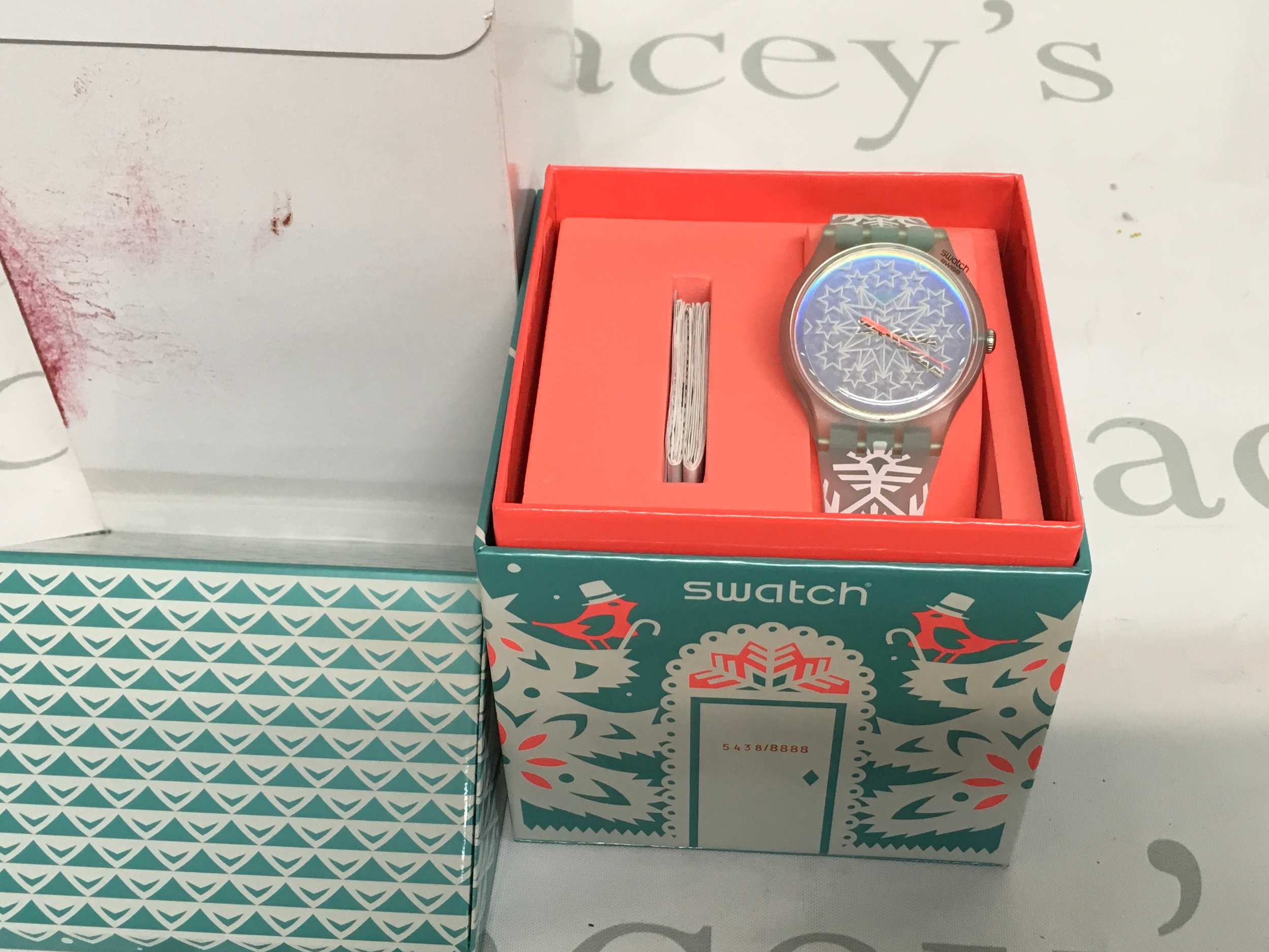 Swatch "God Jul" Christmas Special watch from 2016 (model SUOZ222S), featuring a wintry design and a number on the box