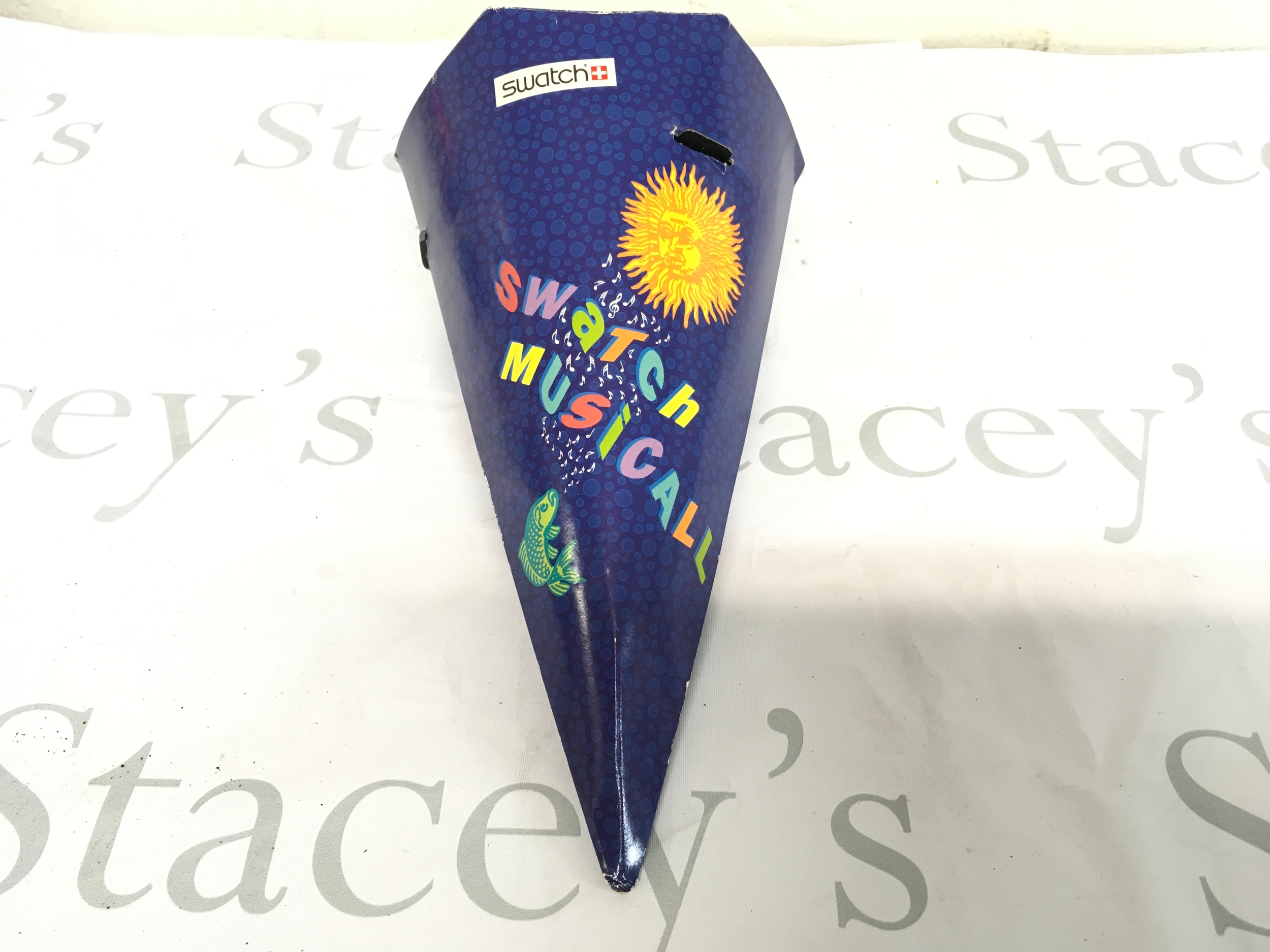vintage 1993 Swatch Musicall "Europe in Concert" watch packaging, designed by Jean-Michel Jarre. The conical blue box features a yellow sun graphic, musical notes, and fish imagery.