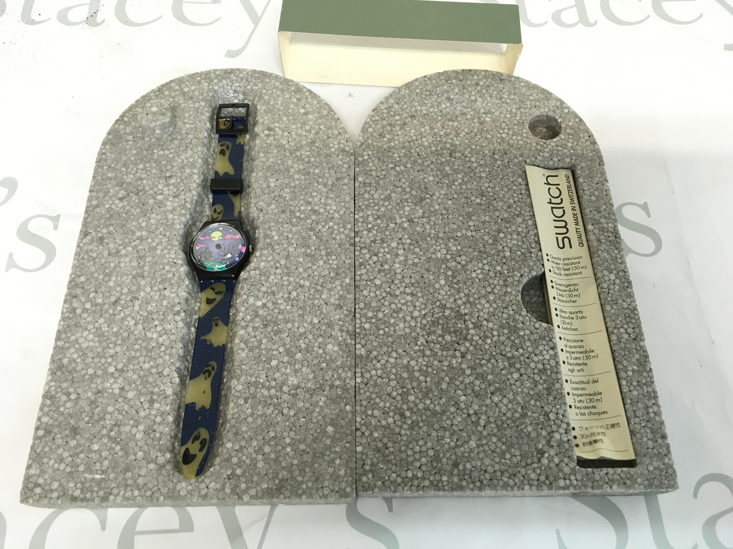 1998 Swatch "Geisterstund" (GB192) Halloween special wristwatch featuring a glow-in-the-dark ghost design. Comes in special collector's "tombstone" polystyrene packaging.