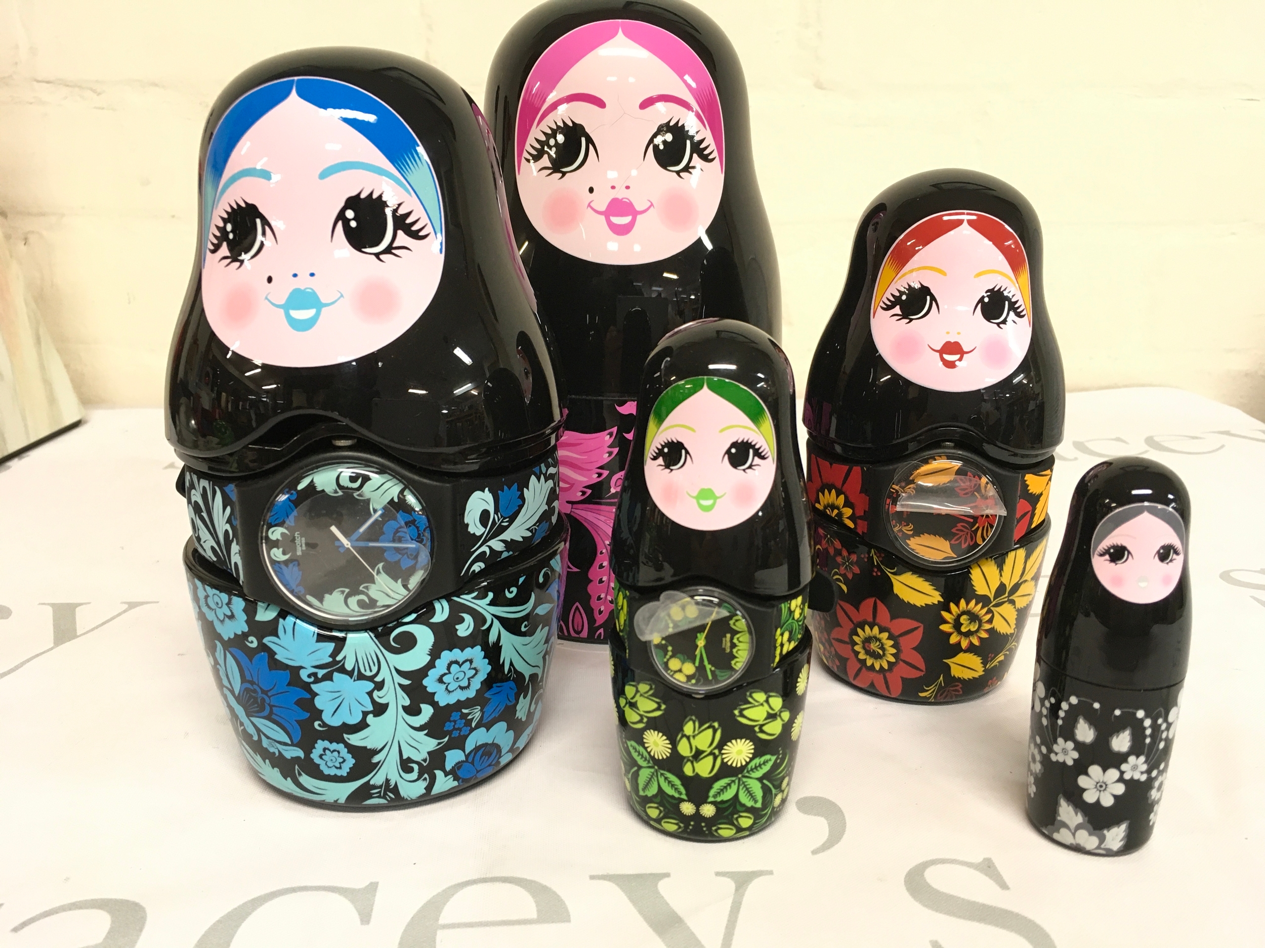 2013 limited edition Swatch Kalinka Malinka SZS07 set, which includes three watches housed inside five Russian nesting dolls