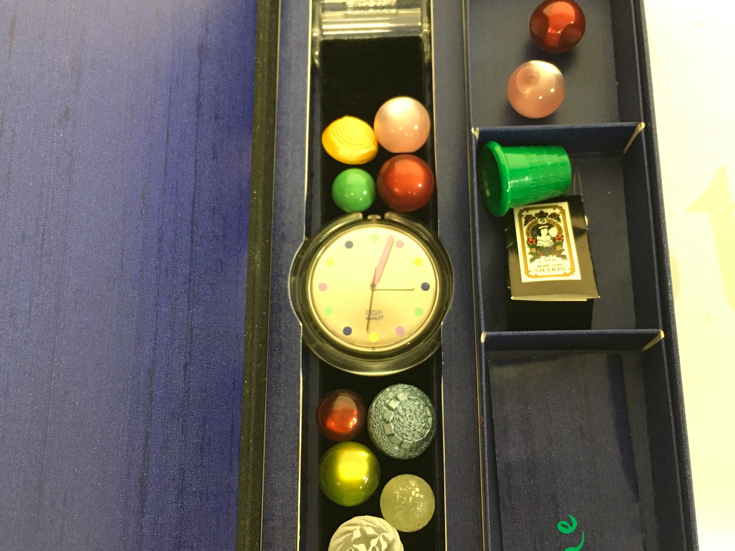 Swatch Pop Special Bottone (model PWK153) from the 1991 Christmas collection. The set includes the watch, which features a velvet band designed to be customised with the included buttons.
