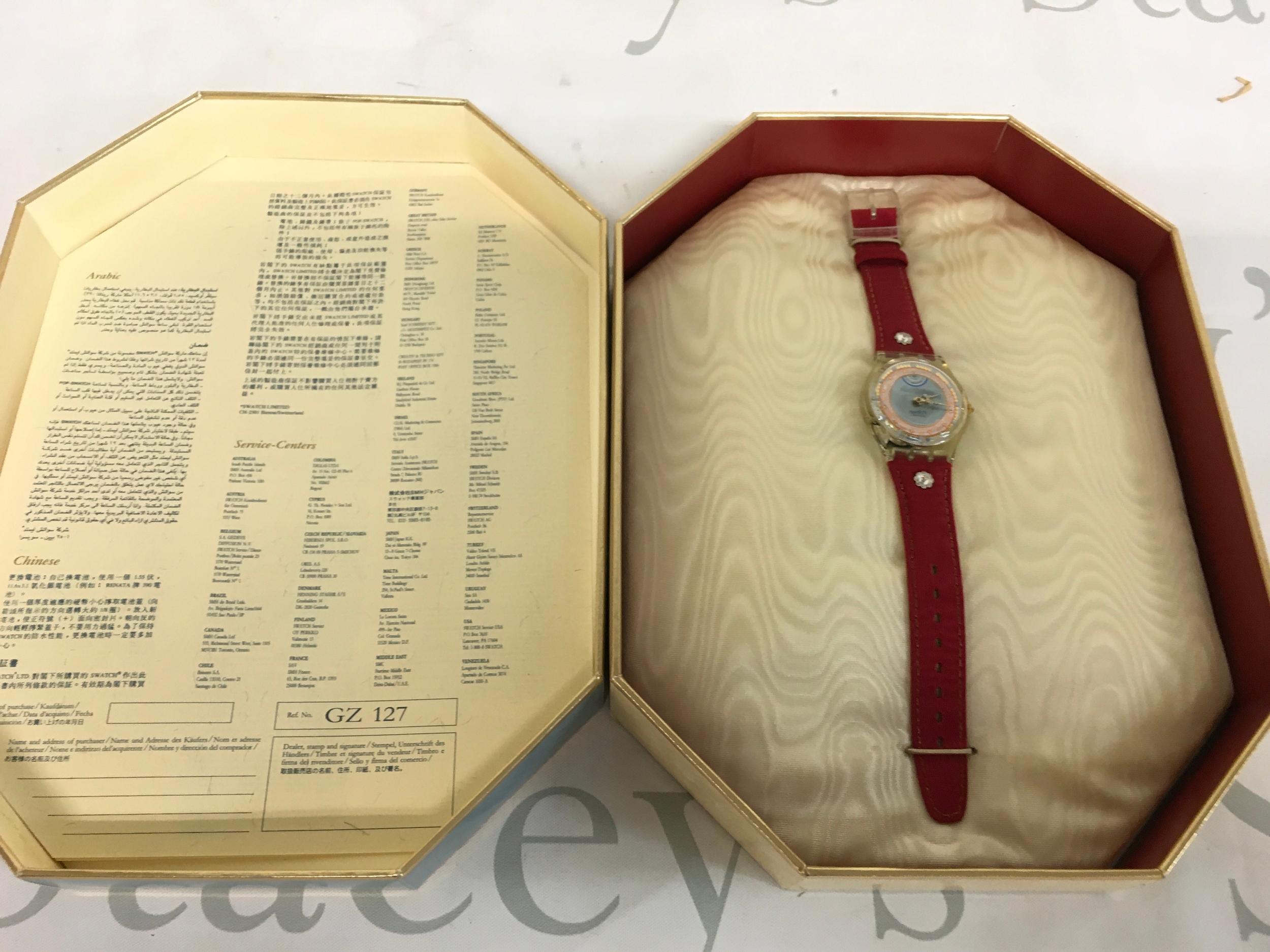 1993 Swatch "Roi Soleil" (GZ127) Christmas Special, featuring a transparent case, a burgundy red leather strap, and a dial dedicated to King Louis XIV