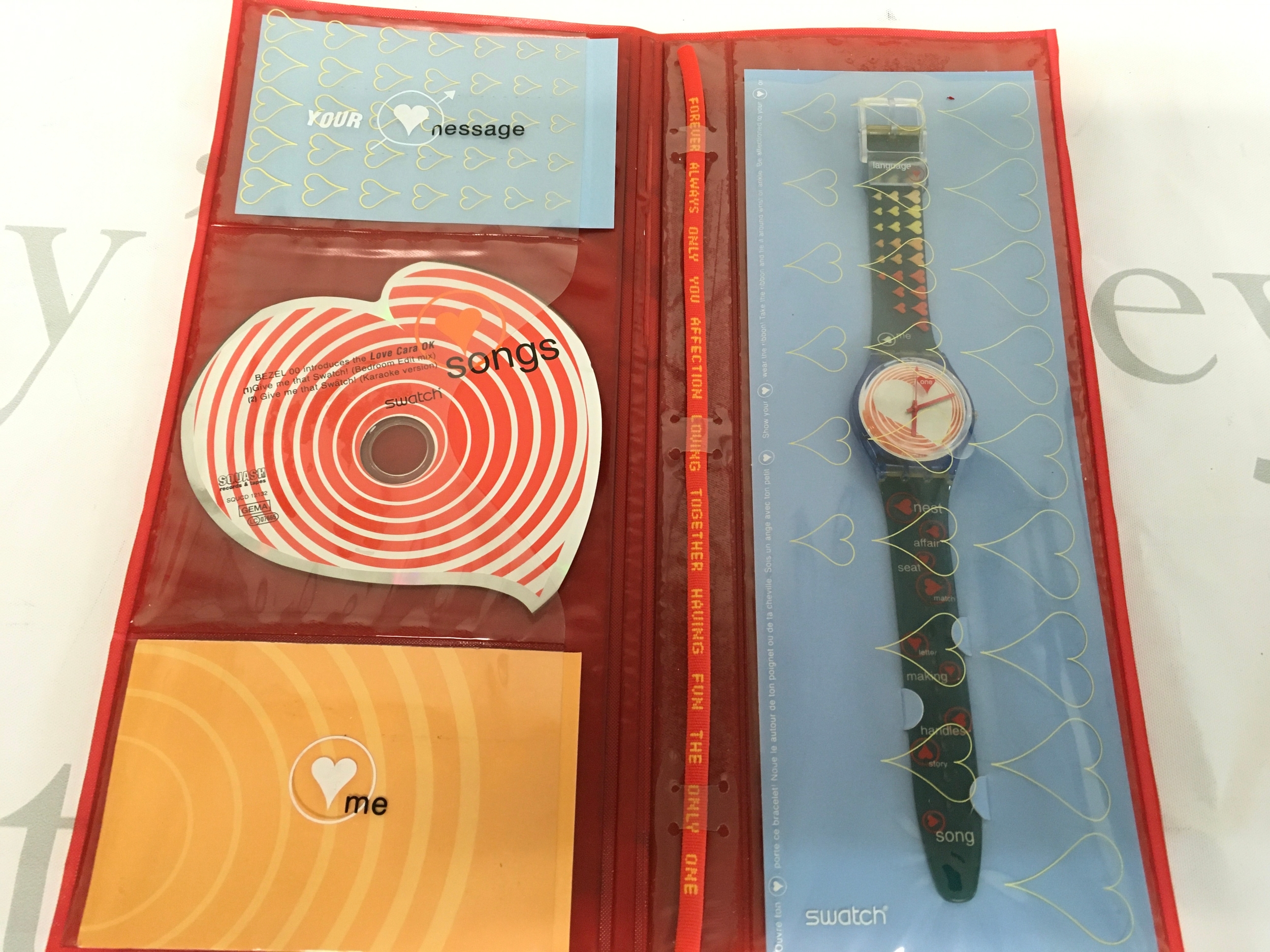 This is a vintage 1999 Swatch "Heartbeat" (GN187) Valentine's Day Special set. The set includes a 34mm Gent watch, a thematic CD, and special packaging.