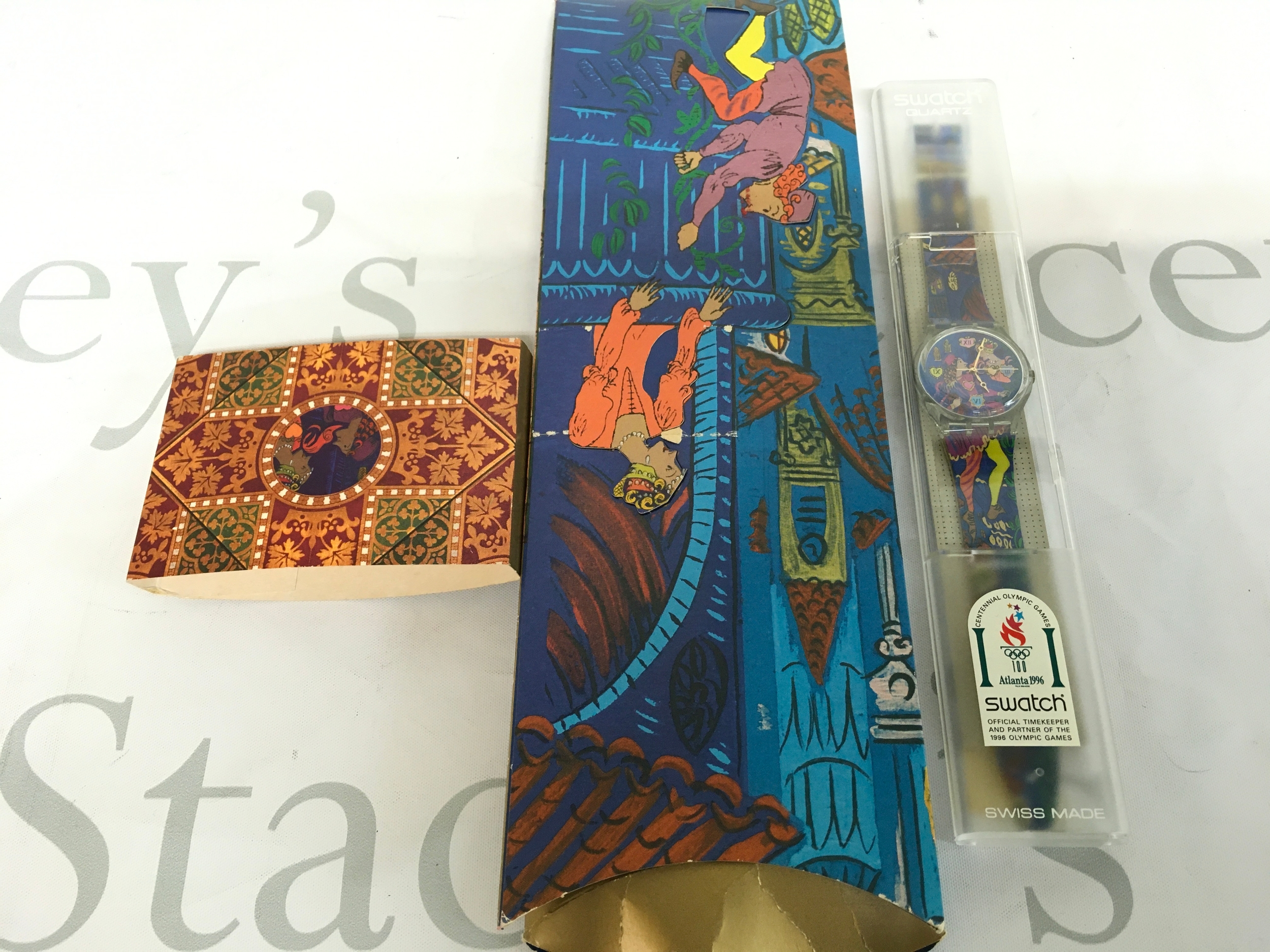 1996 special edition Swatch watch titled "Romeo & Juliet" (Reference GZ153). The watch comes in a unique, illustrated fold-out cardboard sleeve and a hard plastic case