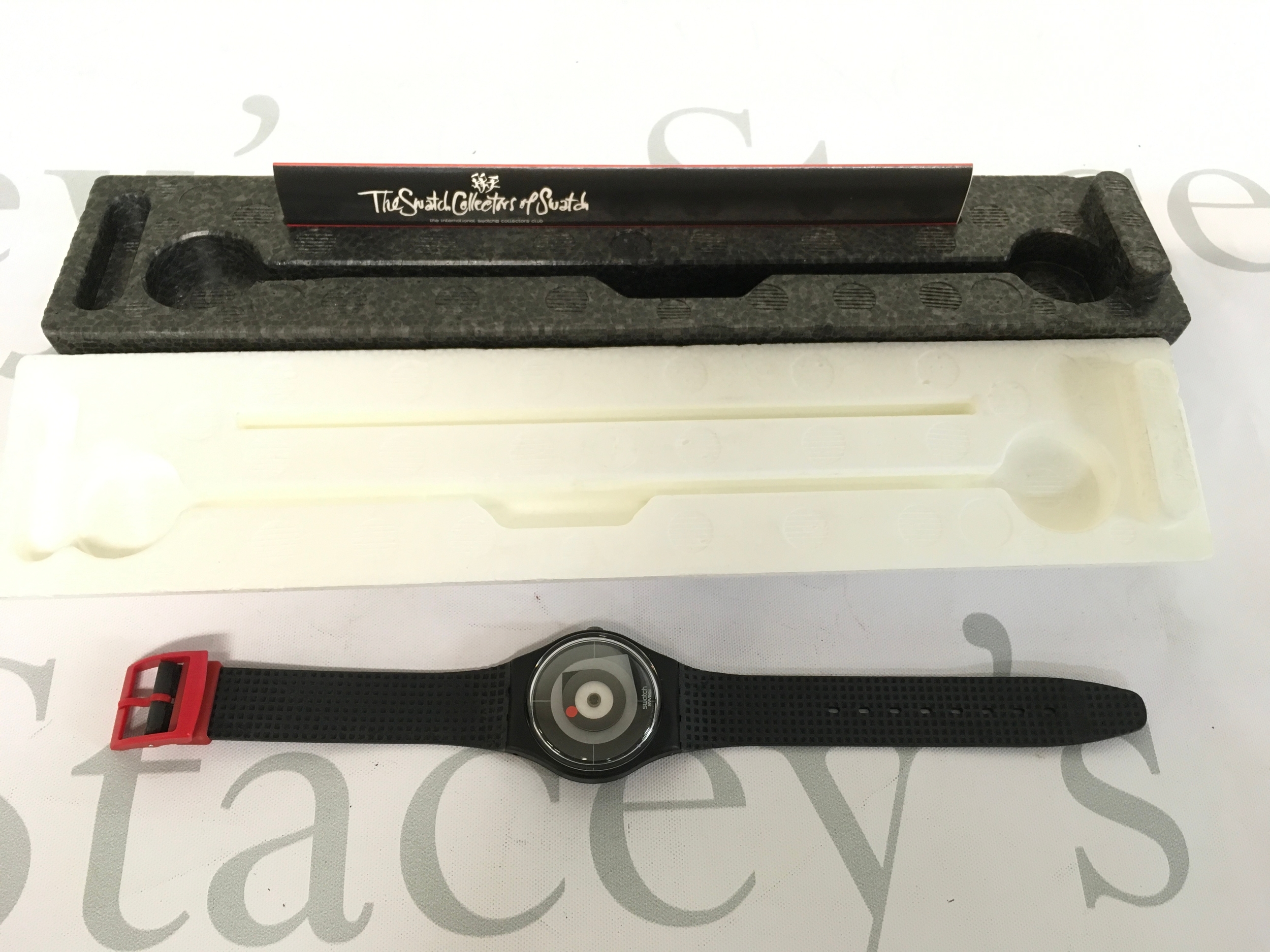 1995 Swatch Club Special "Point of View" (GZ146)wristwatch designed by Karl Gerstner, featuring a minimalistic black and gray dial with a distinct red dot