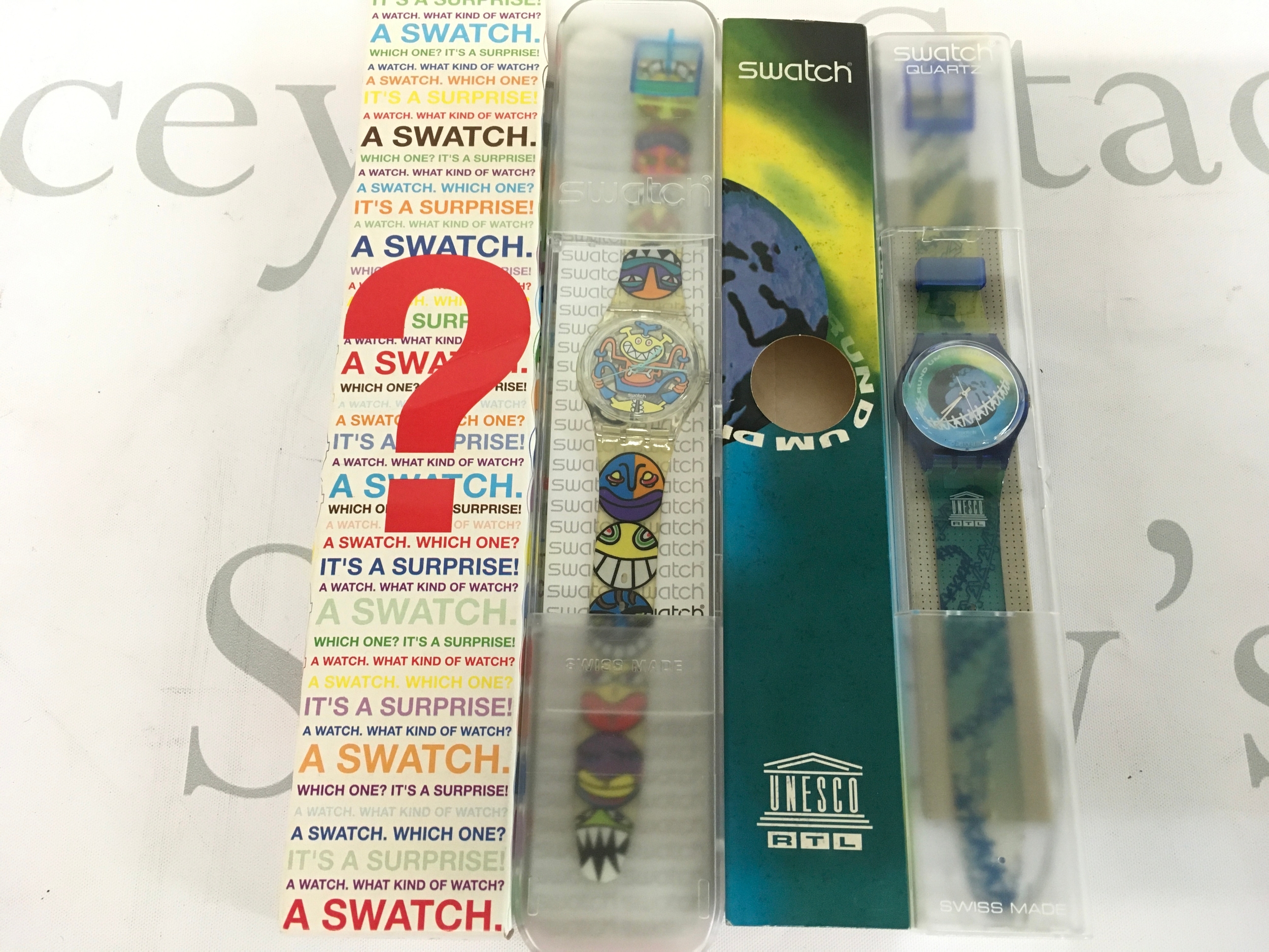 Two Swatch watches includes the 1995 "Swatch Special UNlimited" Chronograph (reference SCZ103) created for the United Nations 50th Anniversary.